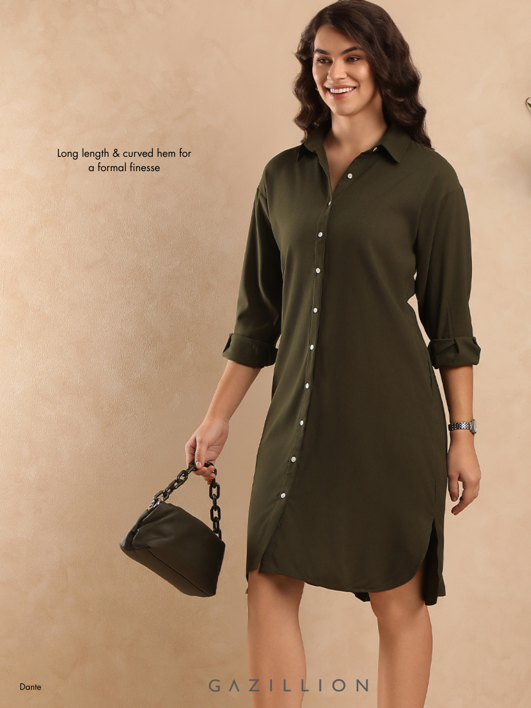 Woman wearing a green dress holding a black handbag on a beige background