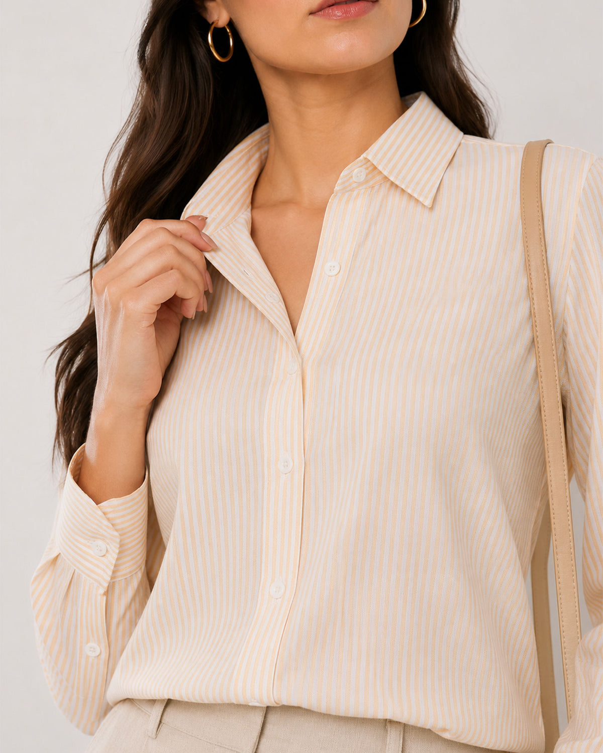 Aksa yellow and white striped shirt placket close-up with the hidden dignity buttons