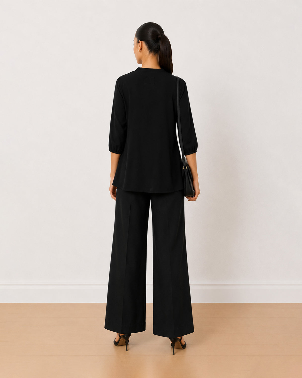 Alda black 100% viscose plus size top back view with the boxy fit and curved hem