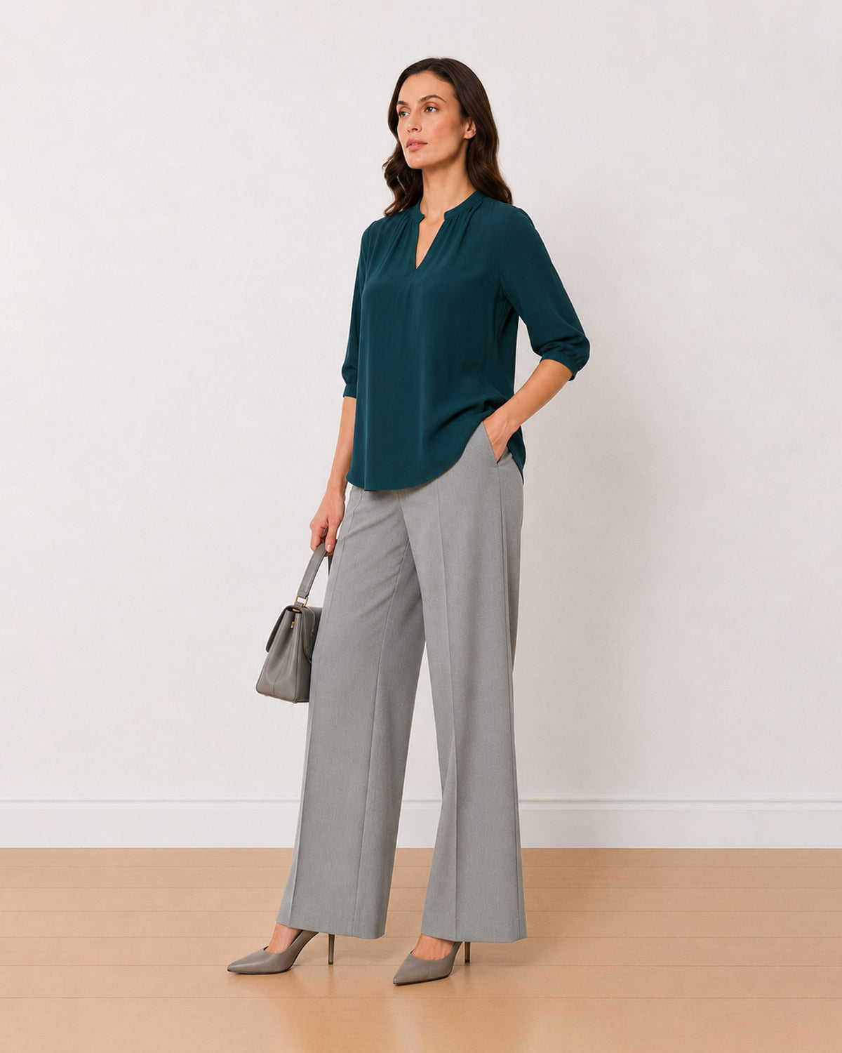 Alda bottle green 100% viscose loose top, angled front view with the boxy fit