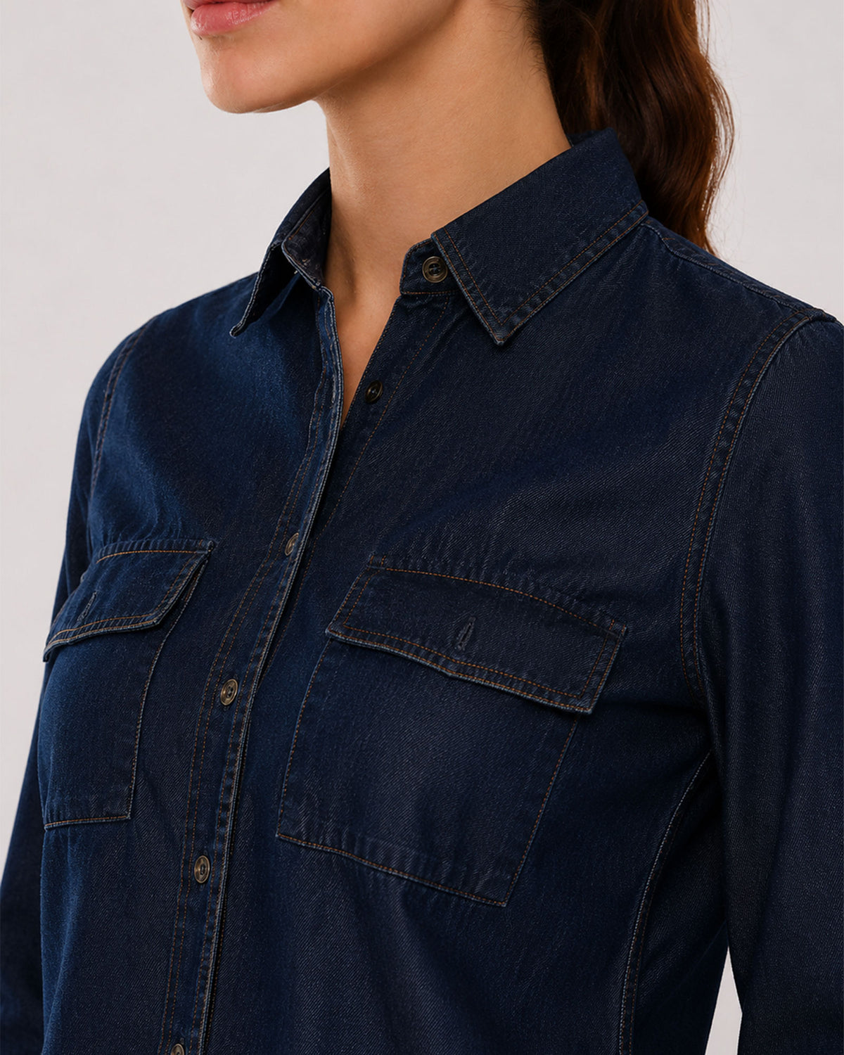 Arena indigo denim shirt placket, utility pocket and hidden dignity buttons