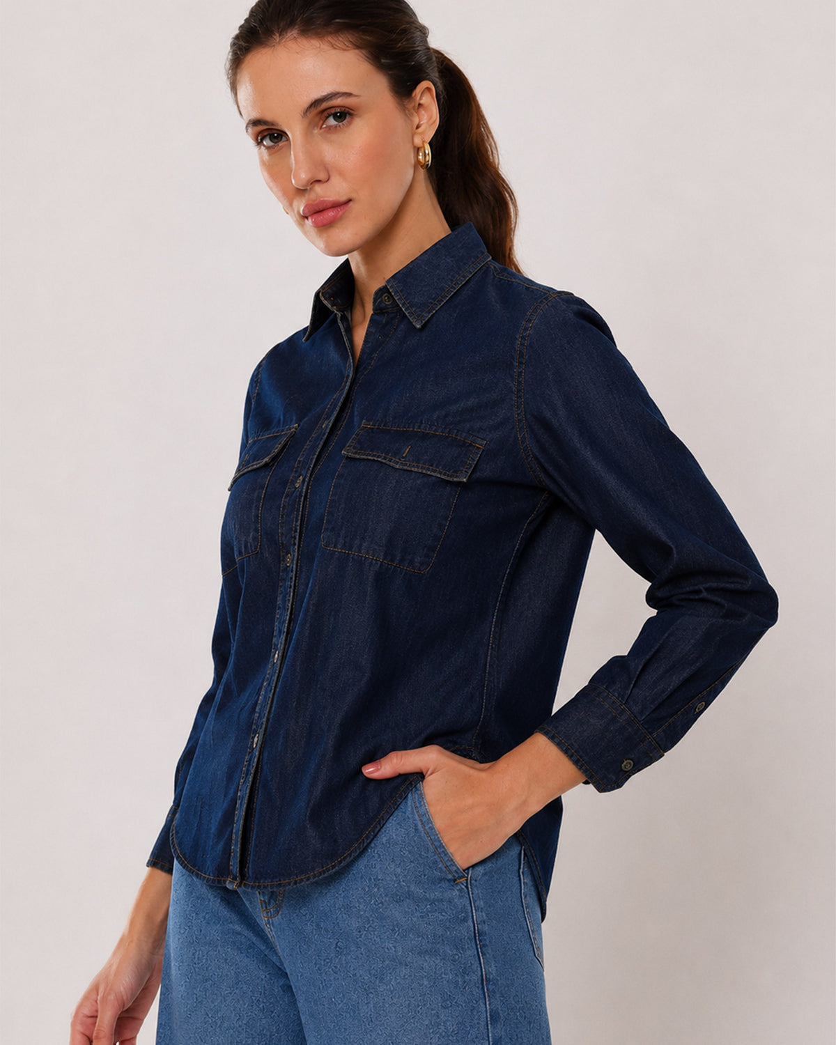 Arena indigo denim shirt waist up front with the 2 flap utility pockets