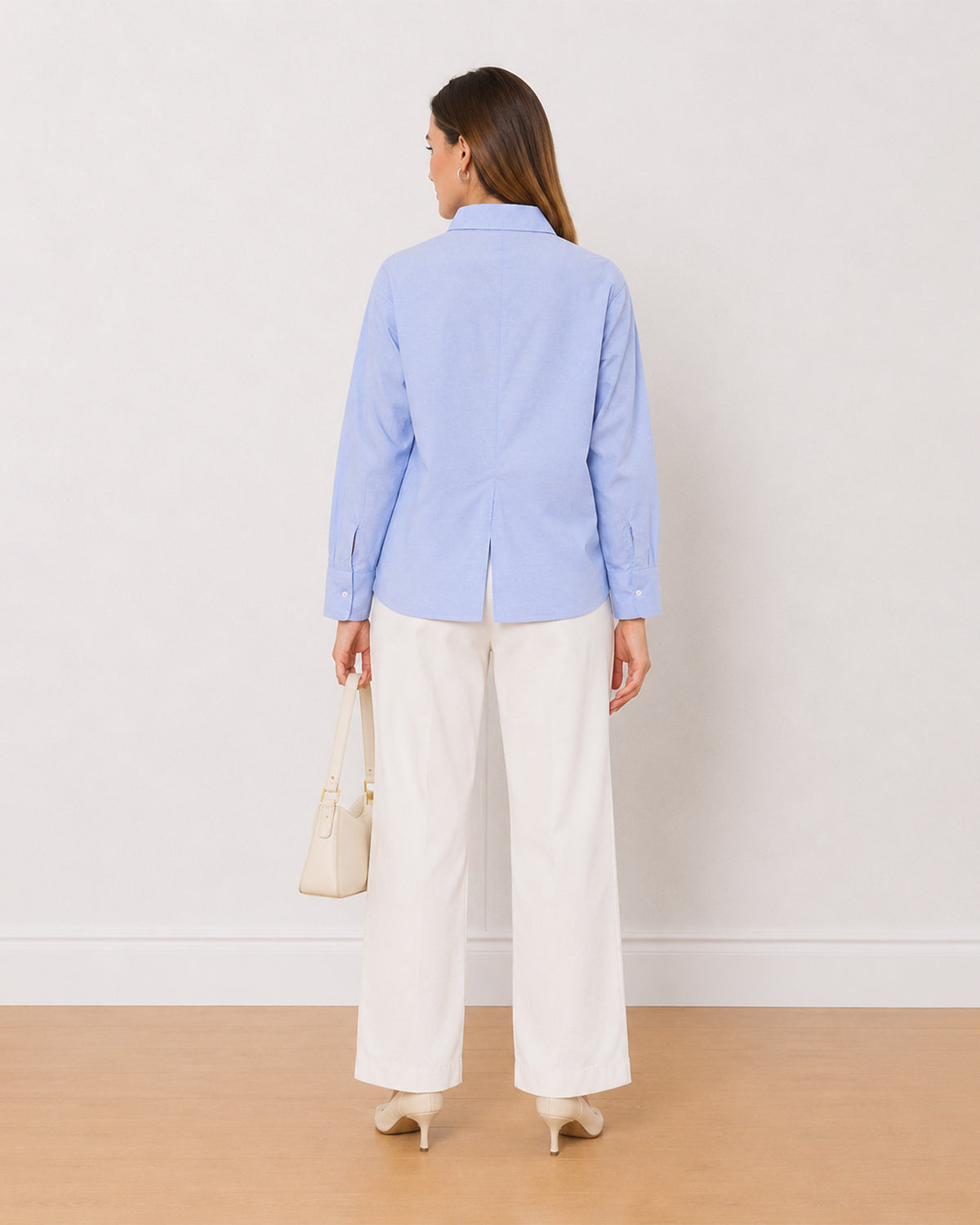 Ava sky blue 100% cotton oversized shirt back view with the centre back slit