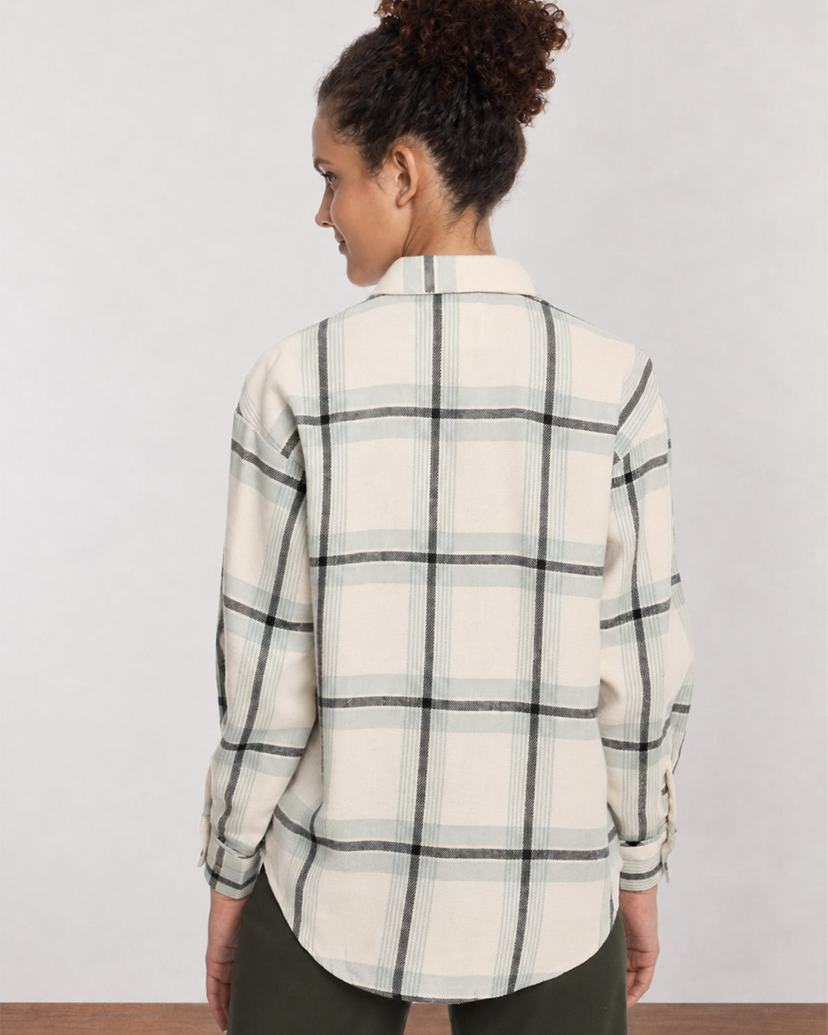 Barbara sage green checks shirt back view with the long curved hem and drop shoulder