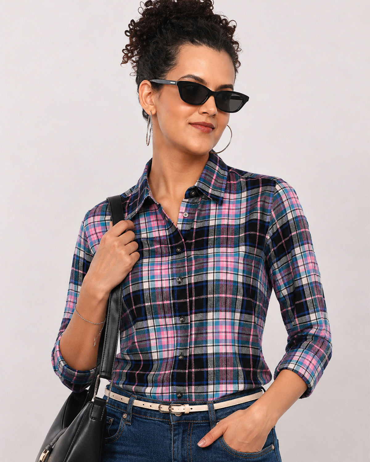 Beauty pink and black checks shirt front detail with the sleeves rolled back