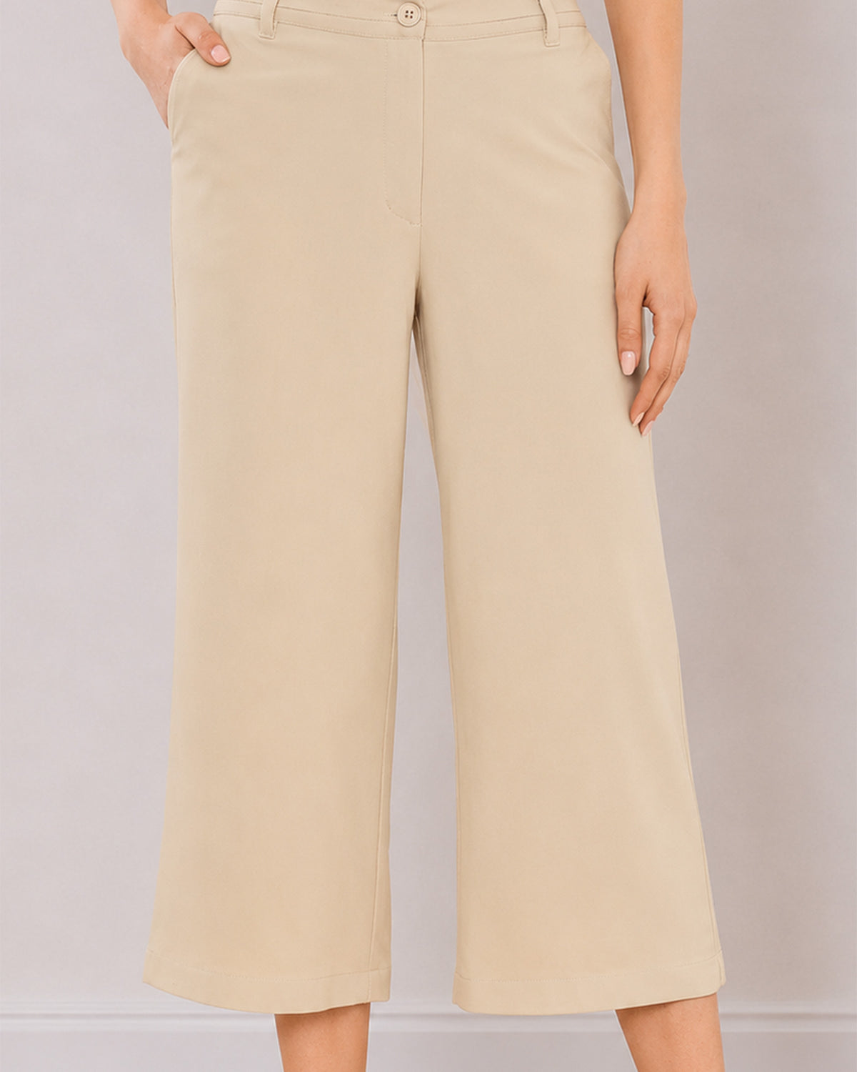 Bella beige pants waistband close-up with button and zip opening and side cross pocket