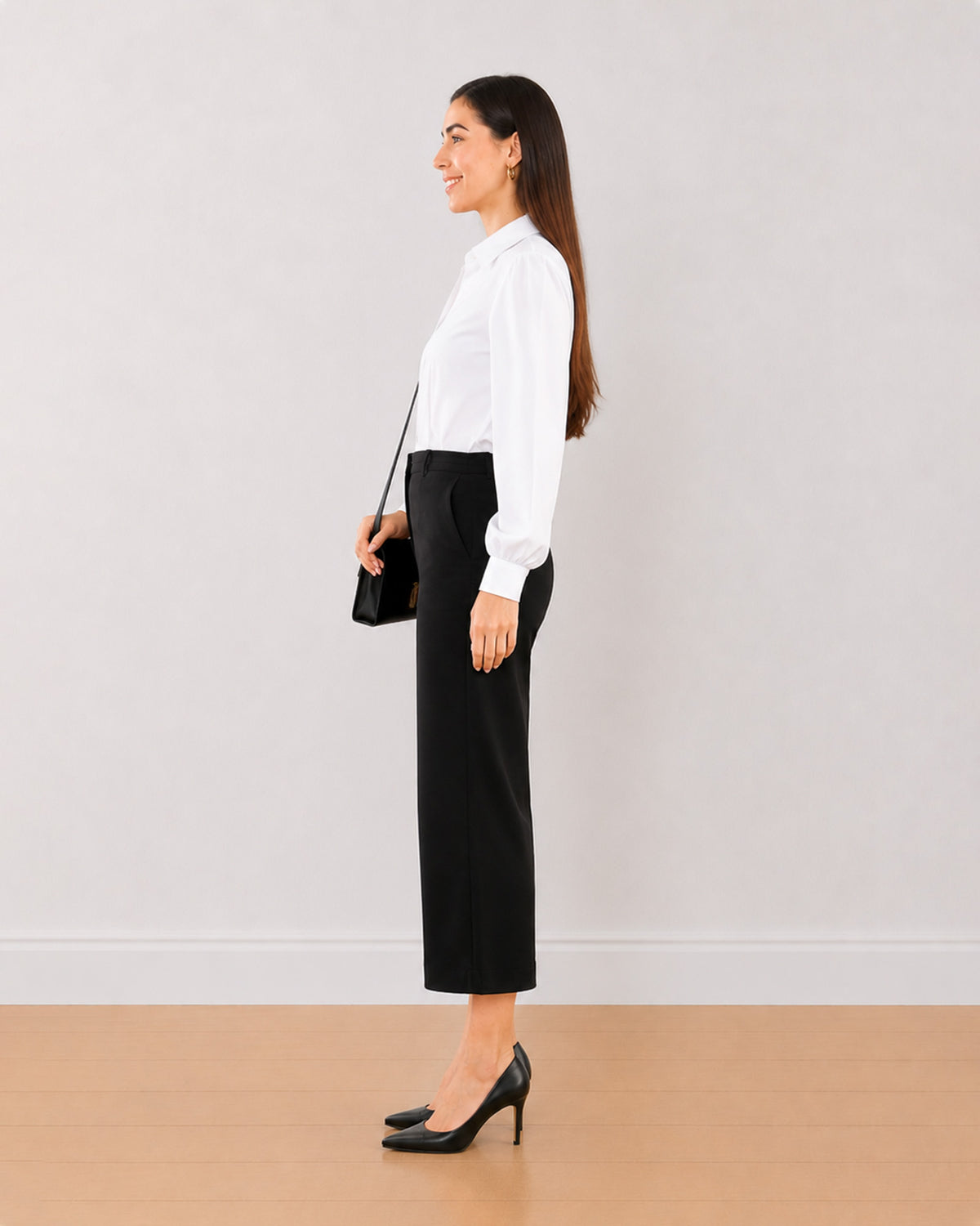 Bella black medium waist 3/4th straight pants, side view with the mid calf hem