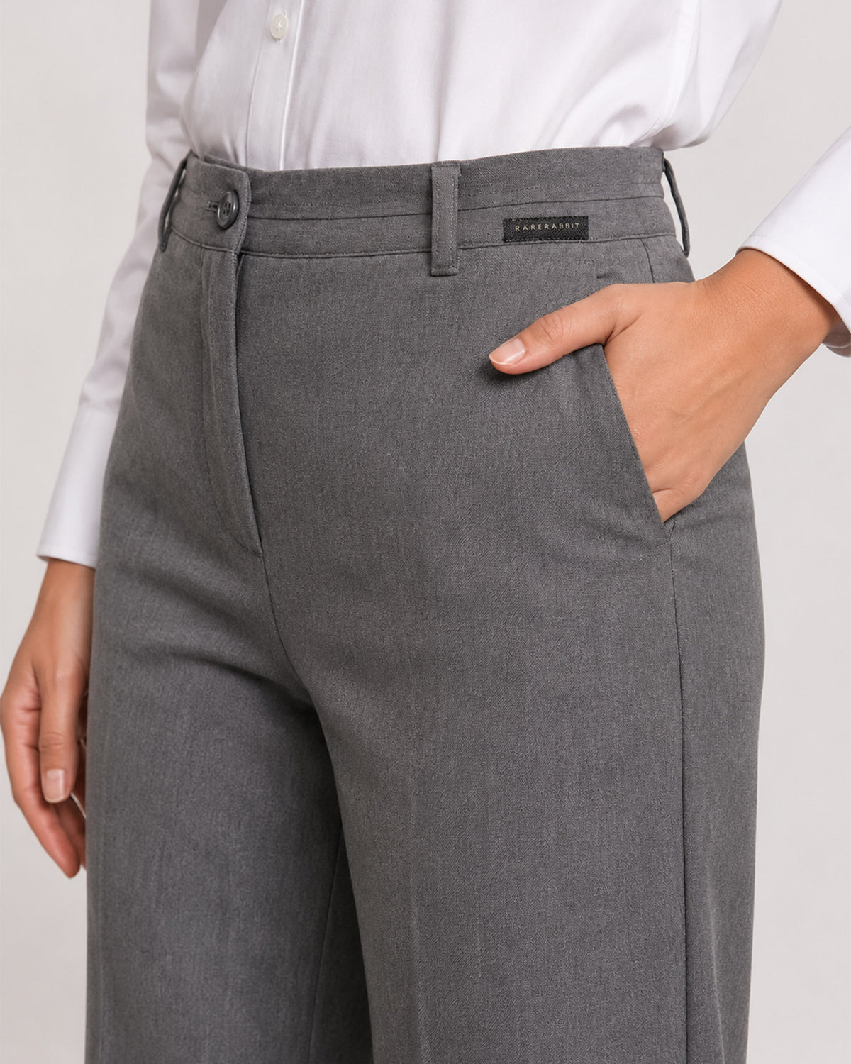 Bella grey pants waistband close-up with button and zip opening and side cross pocket