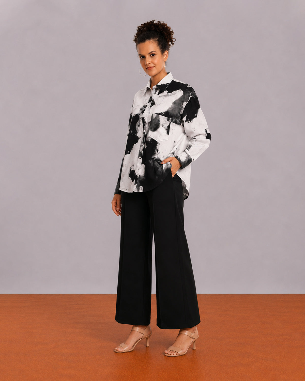 Benna black and white floral print oversized shirt worn loose, front view of the relaxed fit