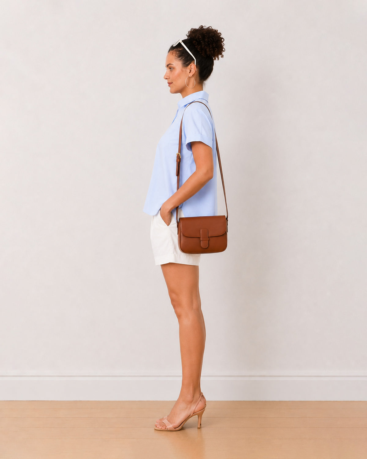 Bershka sky blue oxford cotton shirt side view with the curved hem and boxy fit