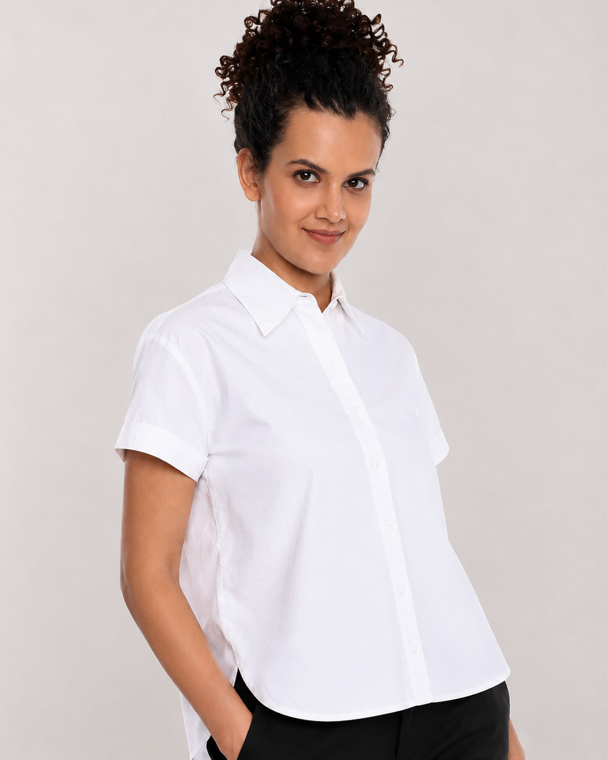 Bershka white oxford shirt, angled waist up view of the collar and half sleeves