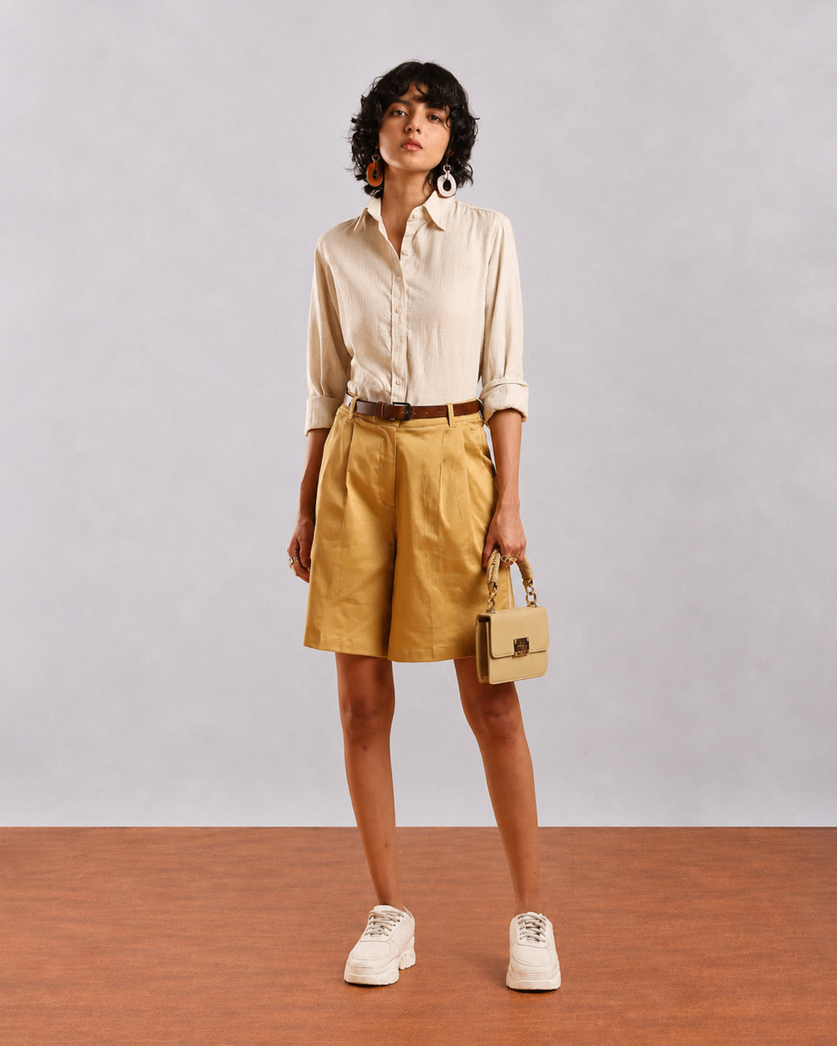 Caleb light grey formal shirt front view with full sleeves rolled up and hem tucked in