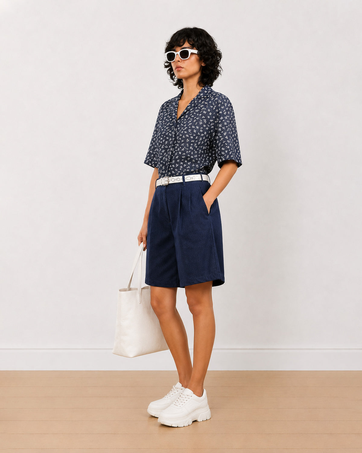 Carrie indigo blue denim bermuda shorts angled front view with a relaxed loose fit