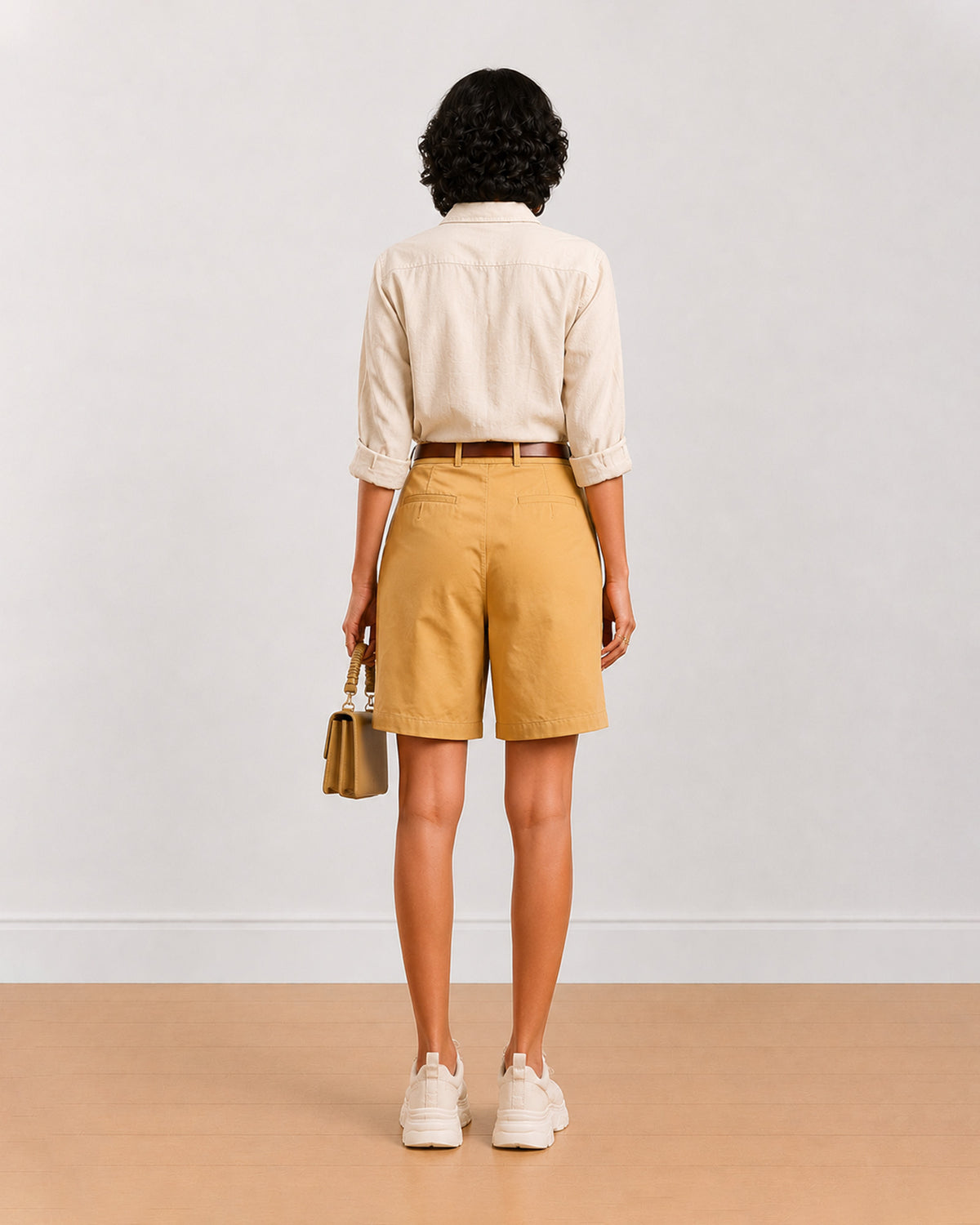 Back view of Celine camel beige bermuda shorts showing back waistband and belt loops