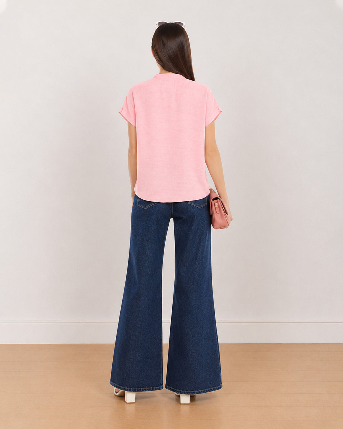 Back view of Chloe pink 100% rayon top showing plain back and extended shoulders