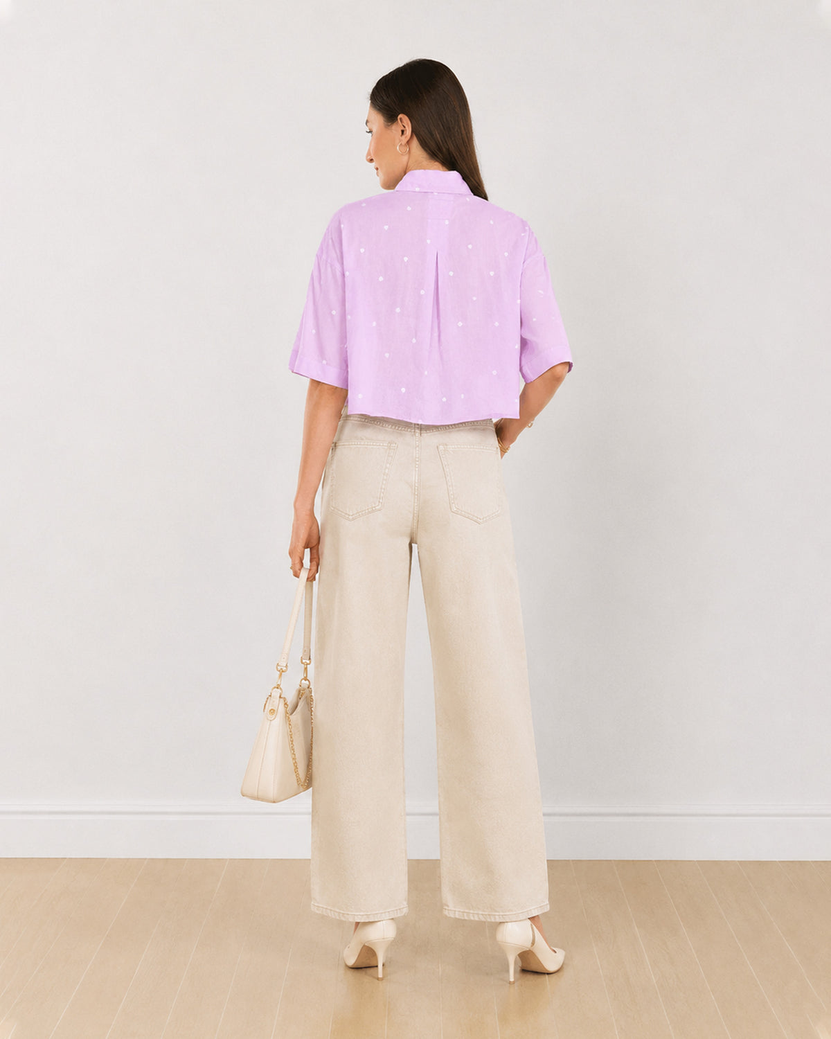 Back view of Christian lavender cropped shirt showing back yoke pleat and cropped hem
