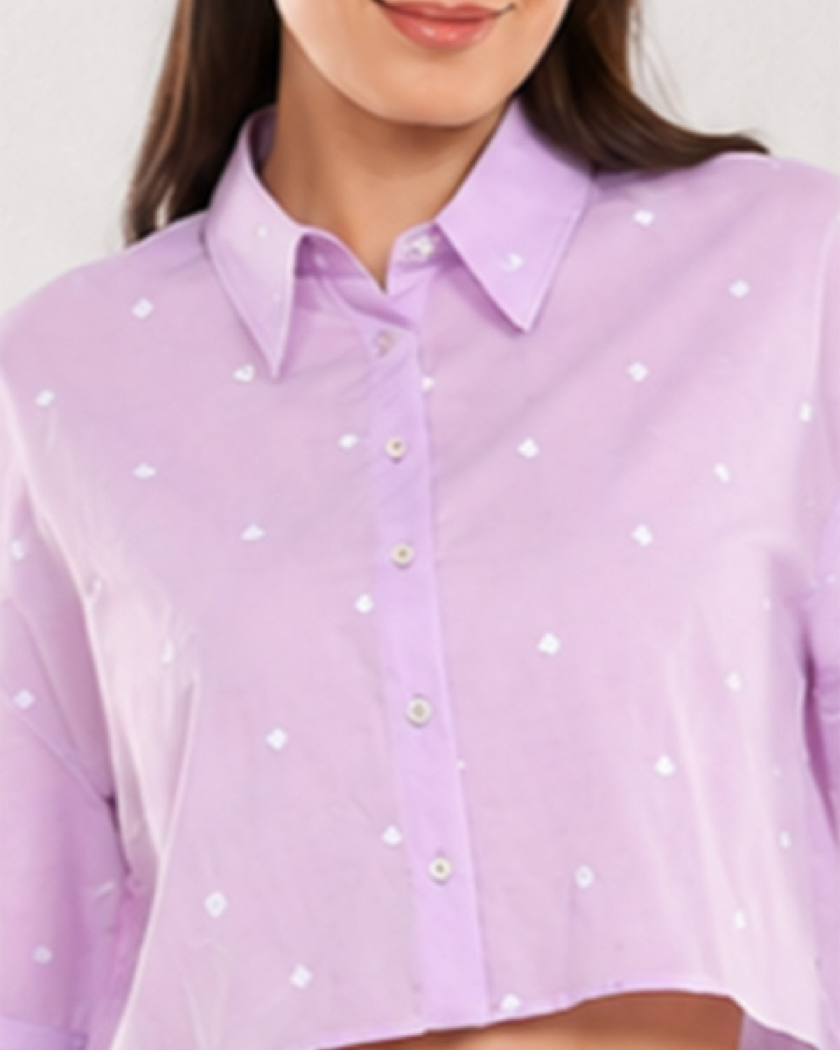 Close-up of Christian lavender shirt with tiny all-over heart embroidery and buttons