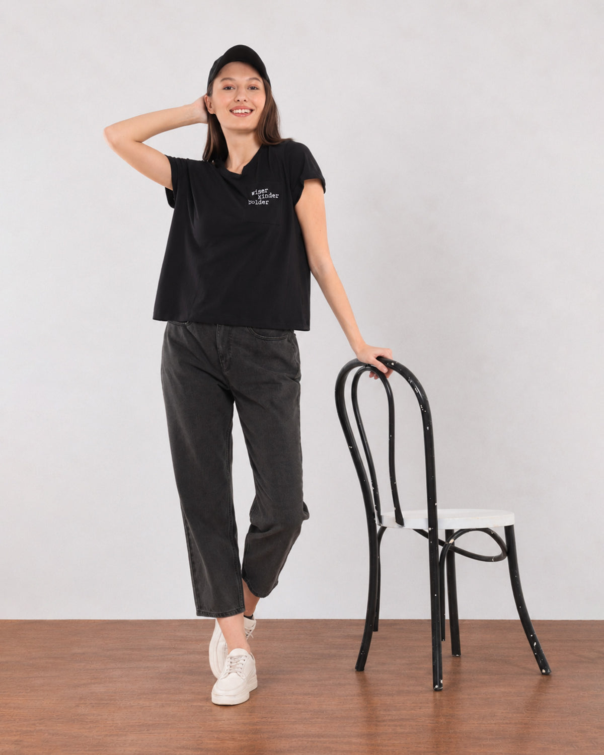Gazillion Christiana black loose cotton t-shirt with Wiser Kinder Bolder pocket print, full-length front view