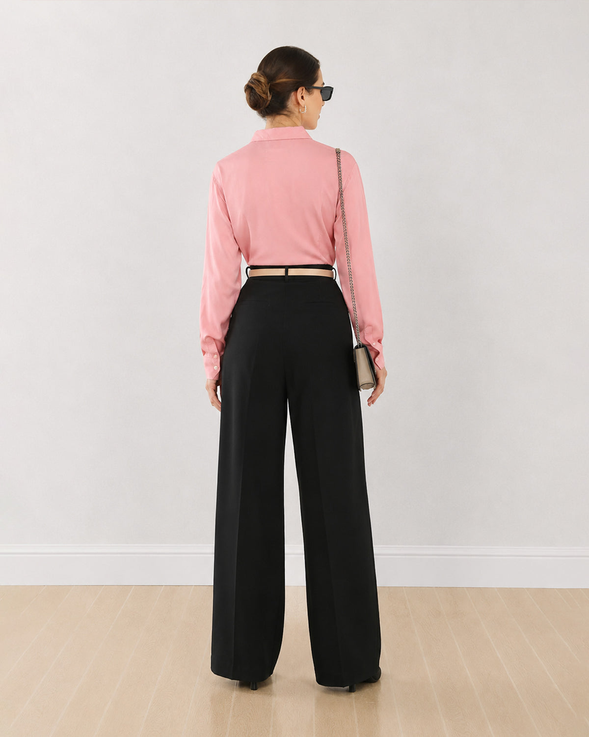 Dalia pink formal shirt, back view showing the back waist darts and buttoned cuffs