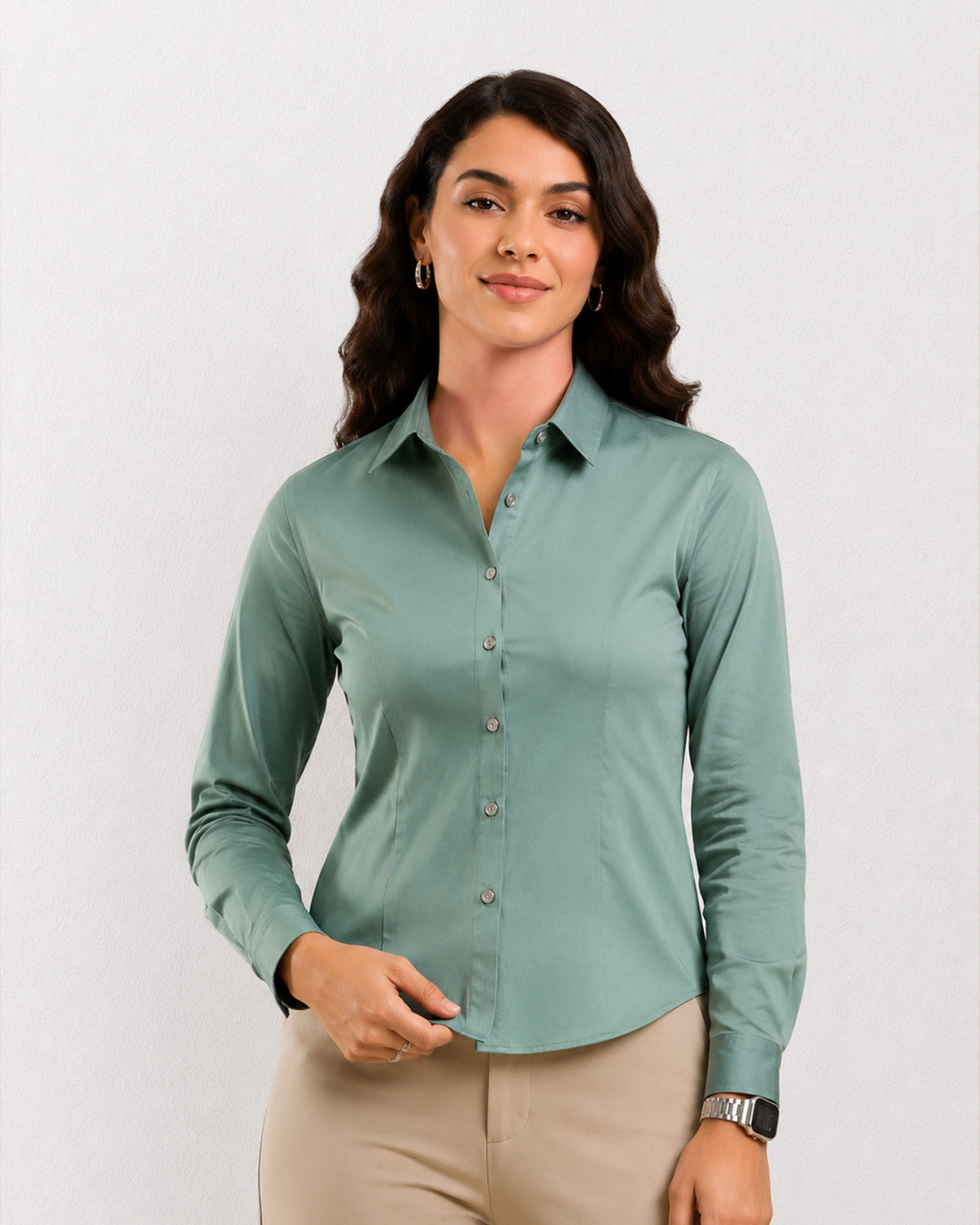 Dame sage green formal shirt worn untucked with a curved hem, front view