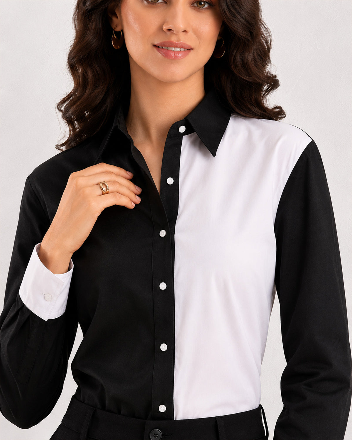 Close-up of Dana colour blocked shirt front panels, placket dignity buttons and white cuff