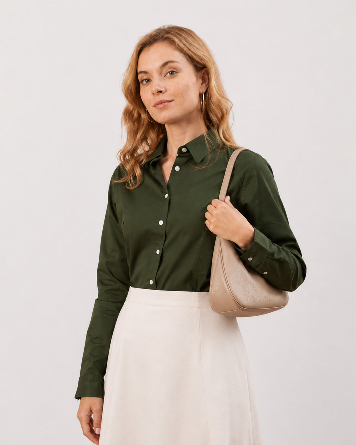 Darleen olive green shirt worn untucked with a curved hem and a buttoned placket, front view