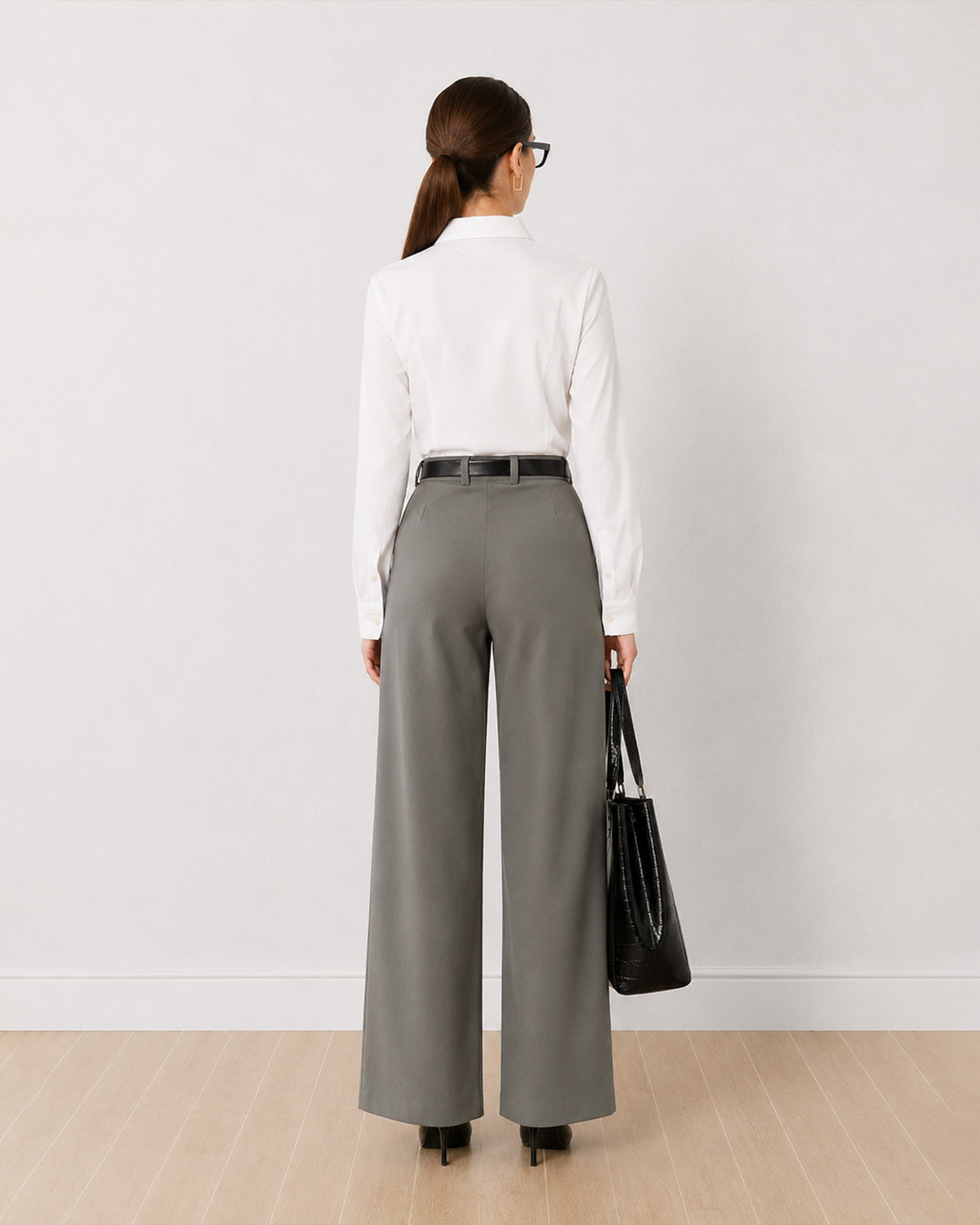 Darleen white formal shirt, back view showing the back waist darts and buttoned cuffs