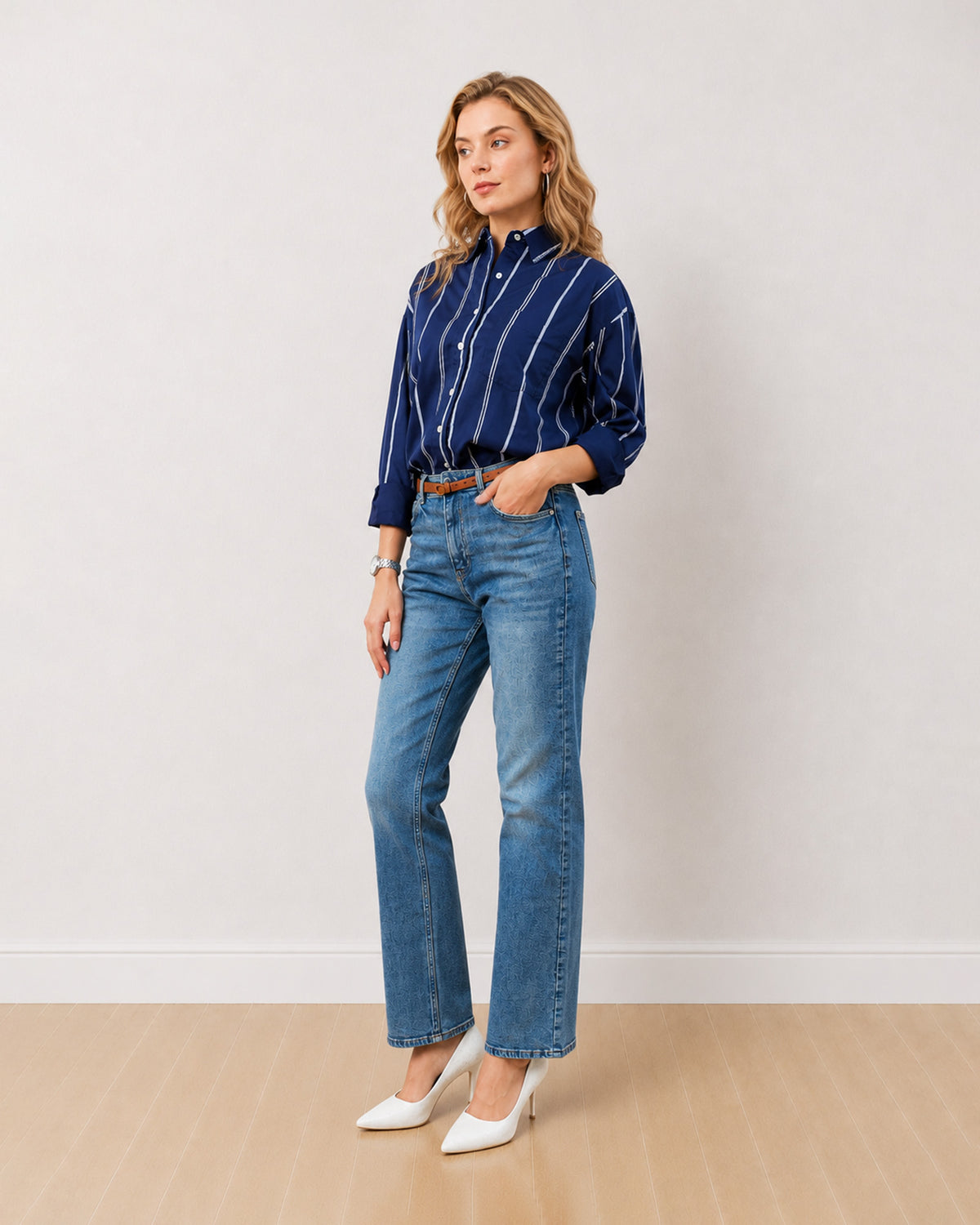 Darlina navy blue striped shirt with an oversized fit and rolled sleeves, angled front view