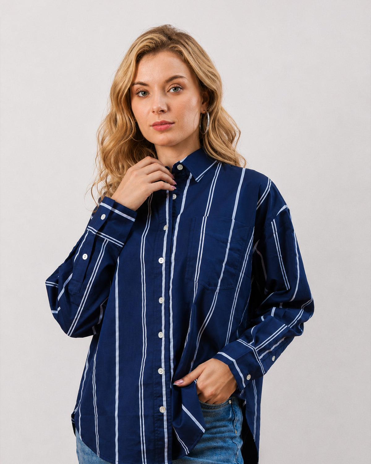 Close-up of Darlina navy blue shirt collar, stripes and drop shoulder seam