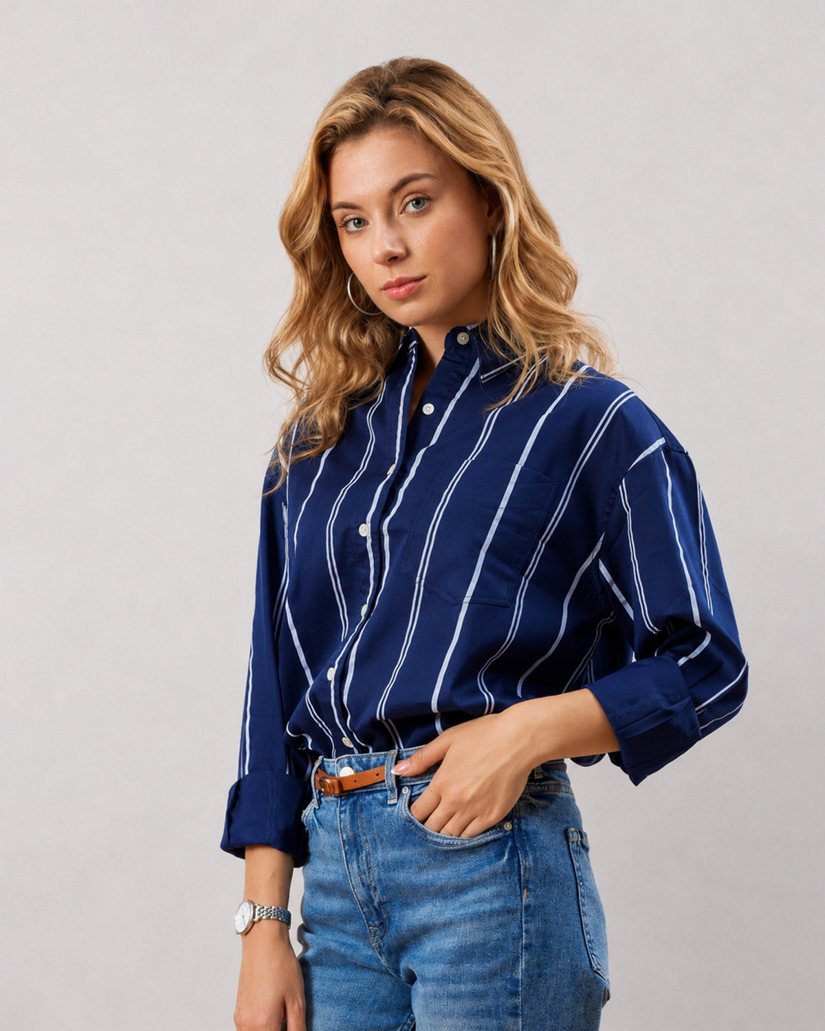 Close-up of Darlina navy blue striped shirt chest patch pocket and hidden dignity buttons