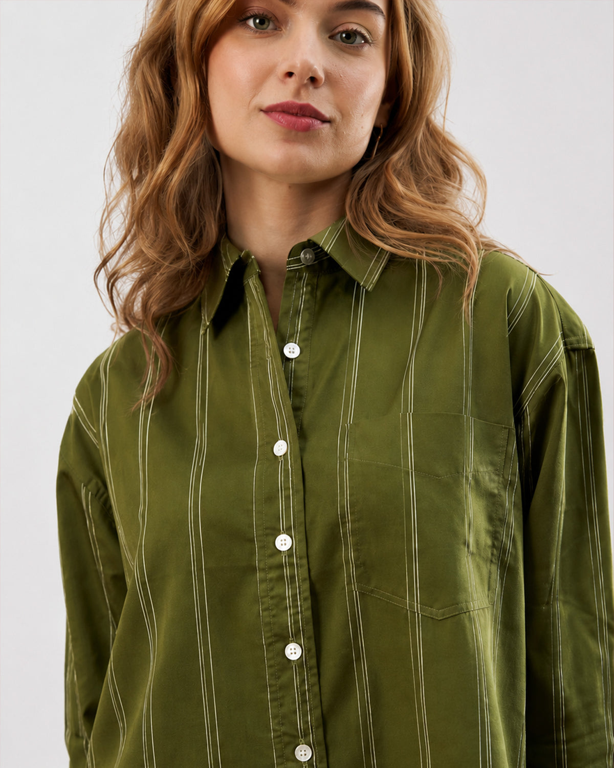 Darlina olive green striped shirt with a drop shoulder and patch pocket, front view