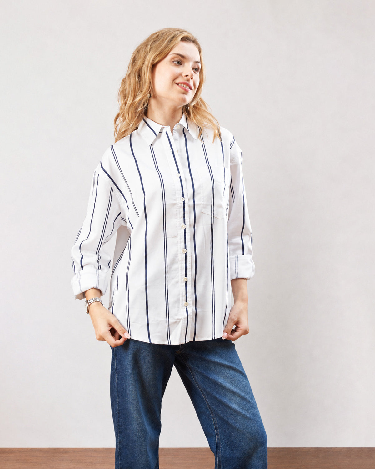 Darlina white striped shirt with an oversized drop shoulder fit, front view