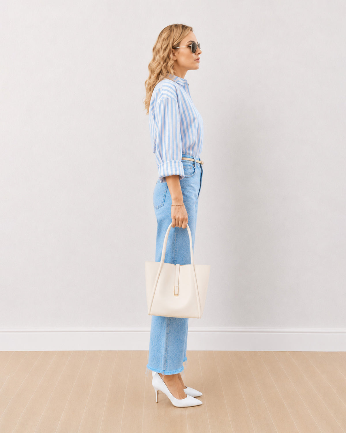 Darryl pink and blue striped shirt with sleeves rolled back, side profile view