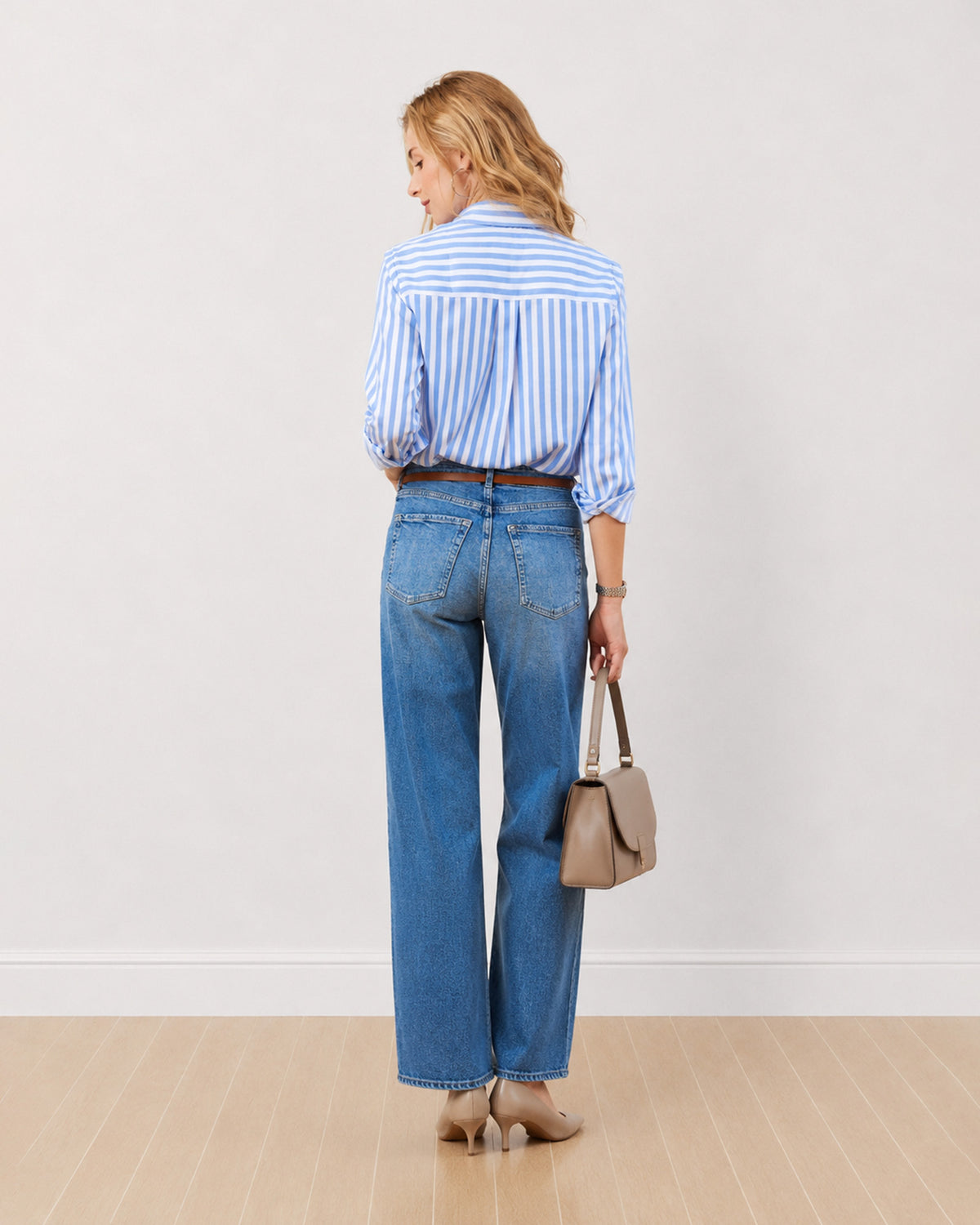 Dede striped cotton shirt, back view showing the horizontal striped yoke and centre back pleat