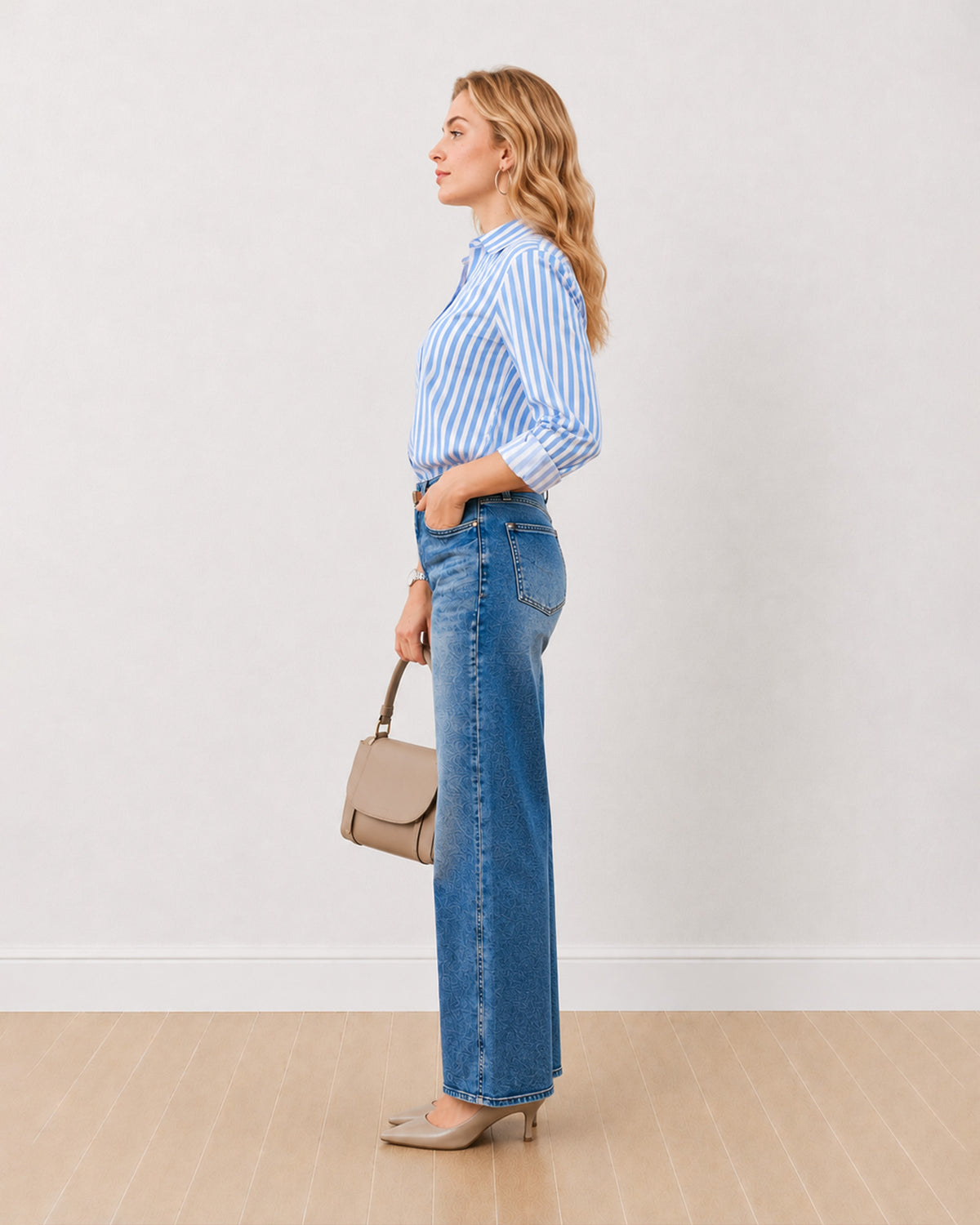 Dede blue and white striped cotton shirt with sleeves rolled back, side profile view