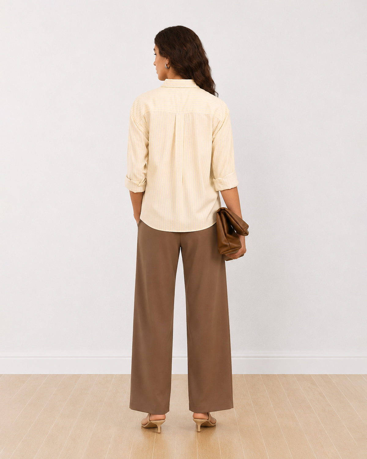 Delisa neon green striped oversized cotton shirt, back view worn loose with rolled sleeves