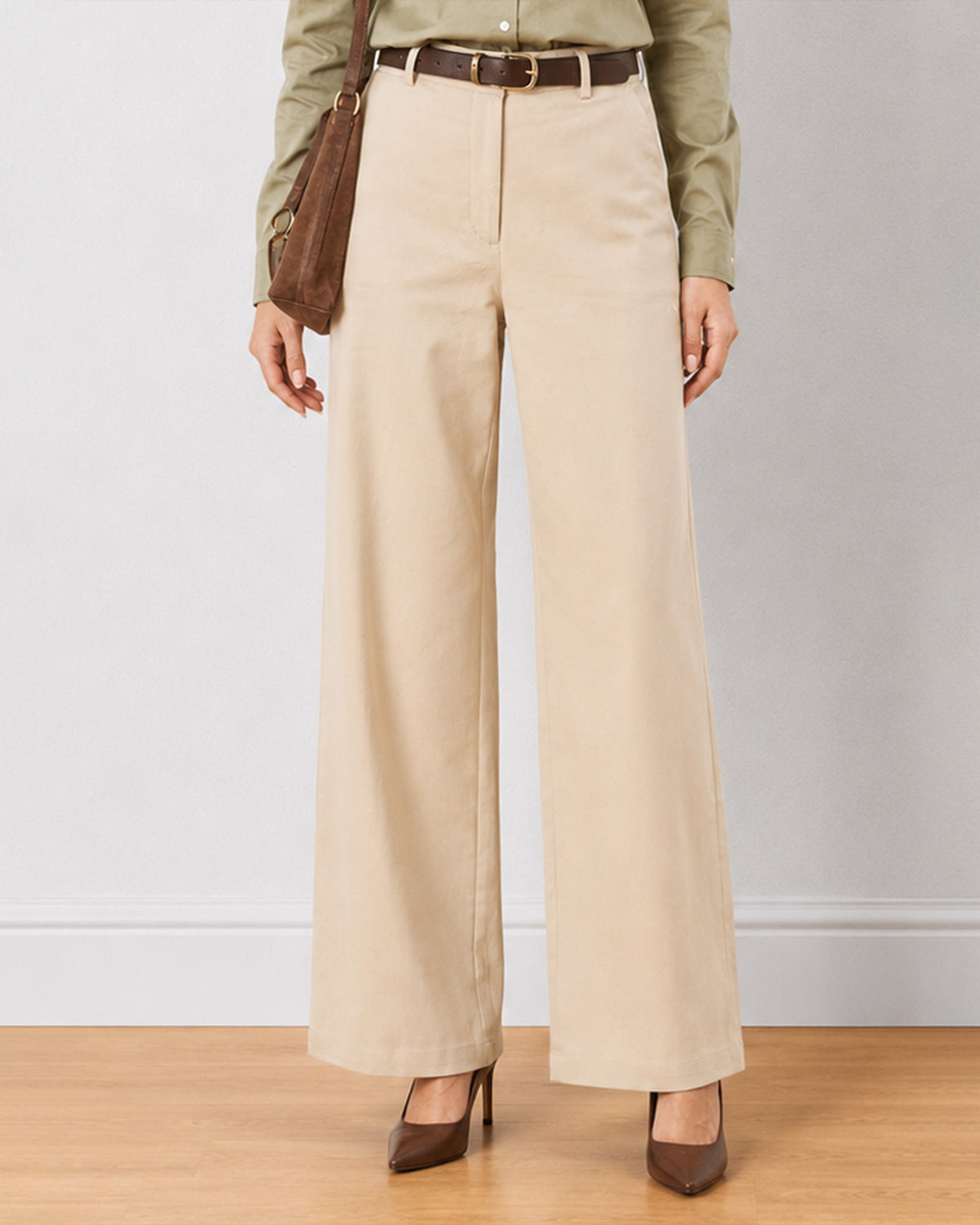 Diane beige formal trousers, close up waist down front view of the wide leg