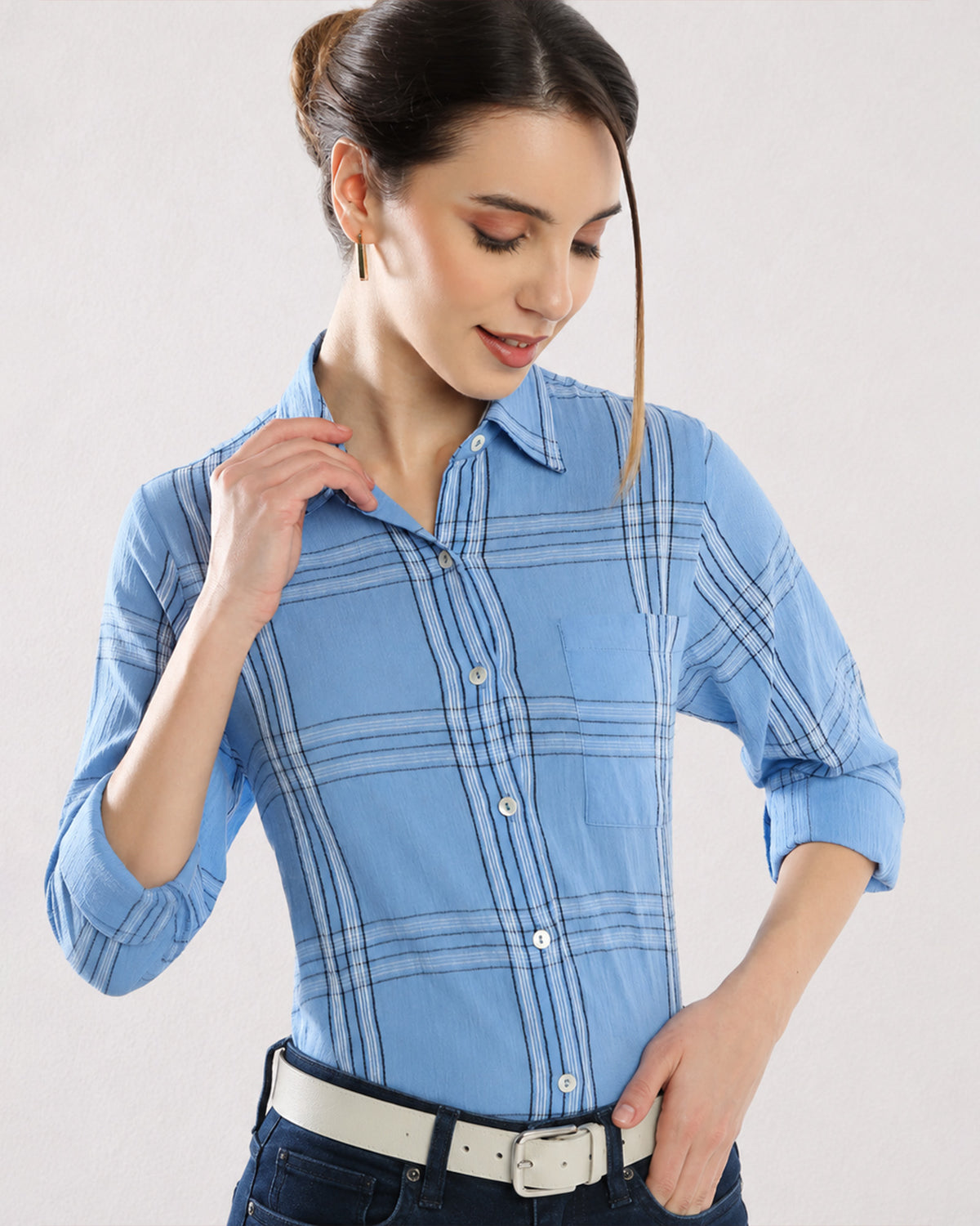 Close-up of Earnia blue checks cotton shirt collar and shoulder stitching