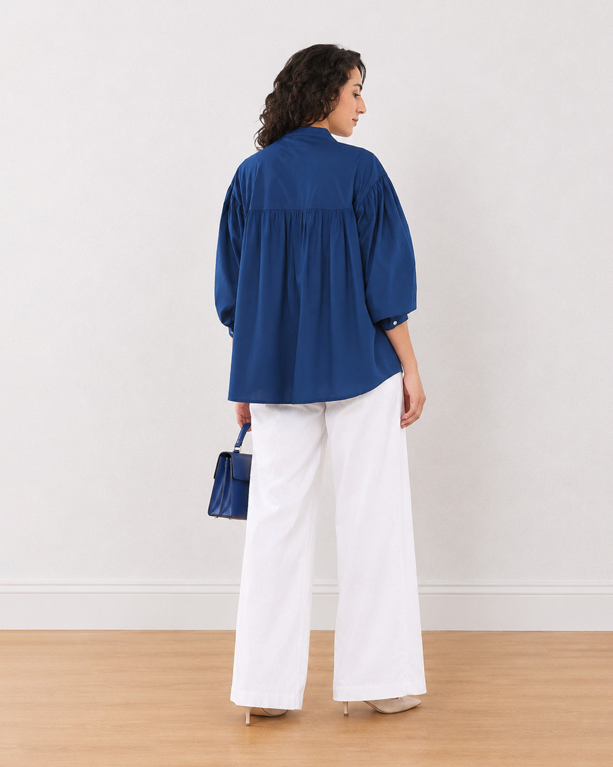 Ellie dark blue stylish cotton shirt, back view showing all-round gathers