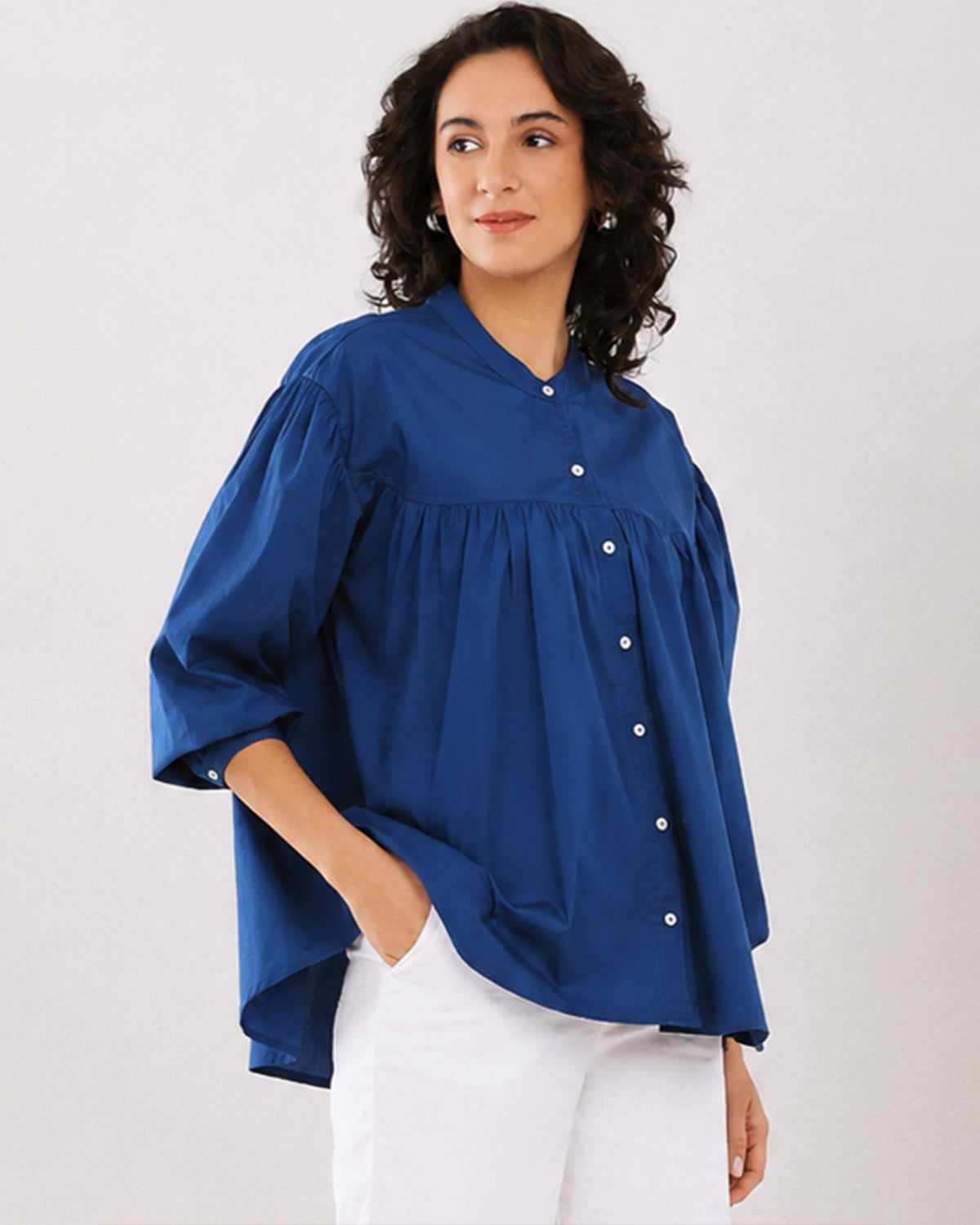 Close-up of Ellie dark blue shirt gathers, button placket and dignity buttons