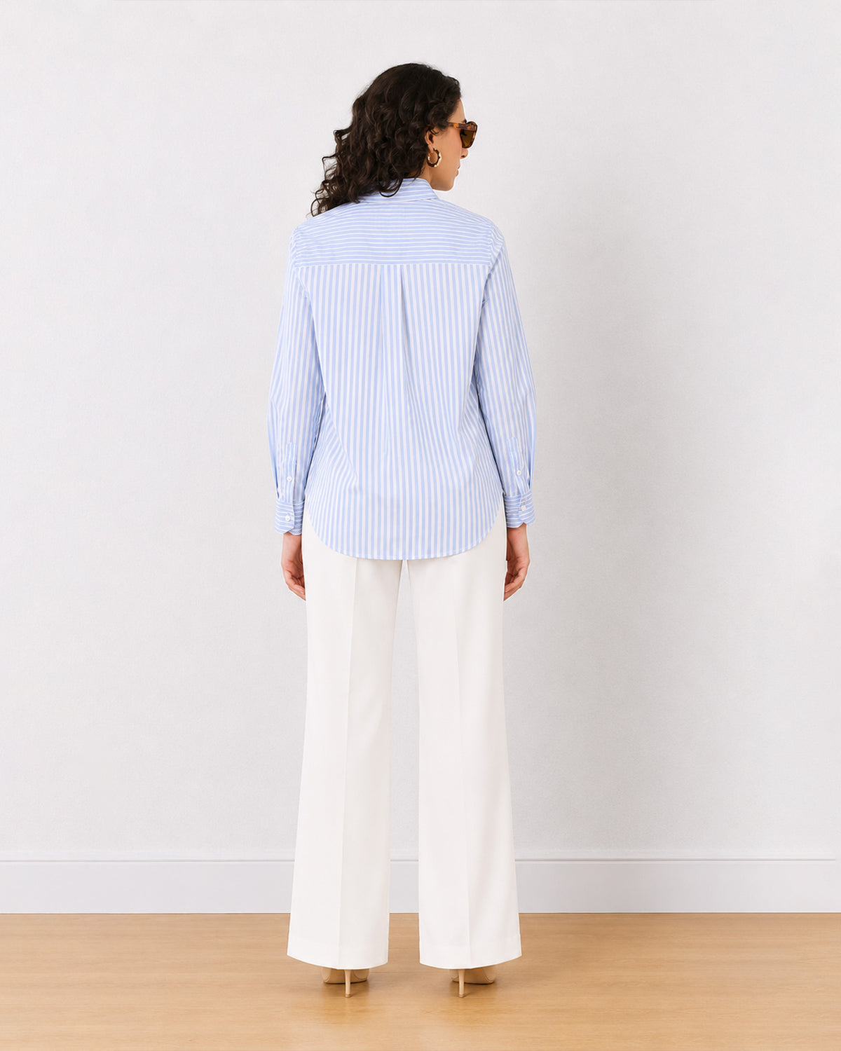 Emma blue and white stripes cotton shirt, back view showing the centre back pleat