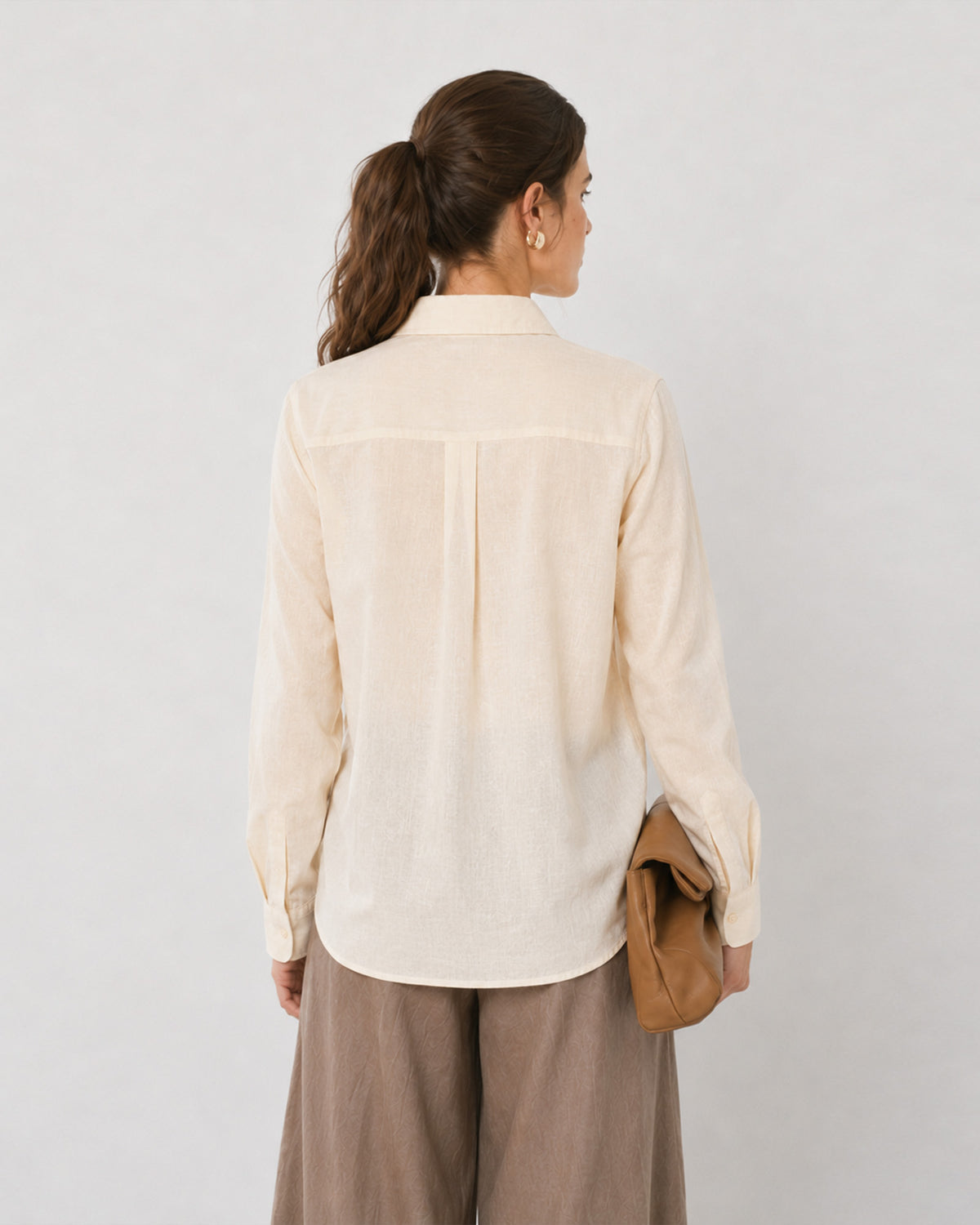 Falcon beige soft linen formal shirt, back view showing the curved shirttail hem