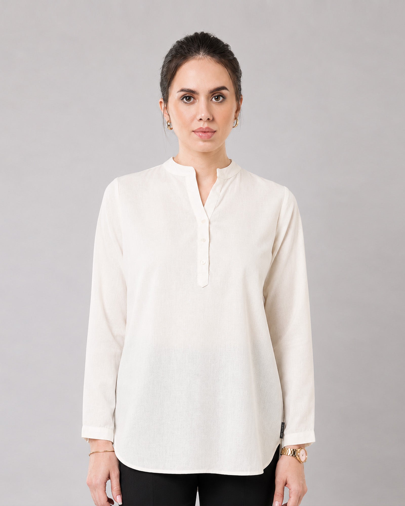 Close-up of Gemini beige linen tunic split V-neckline, band collar and button placket