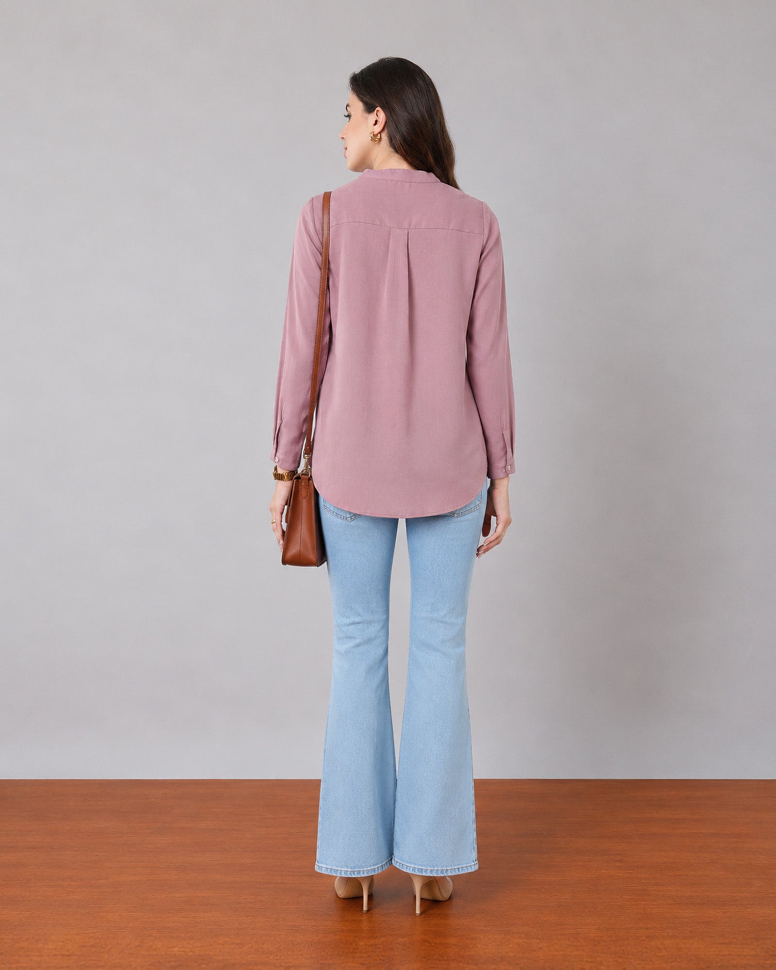 Gemini rose pink linen tunic top, back view showing shoulder pleats and a curved split hem