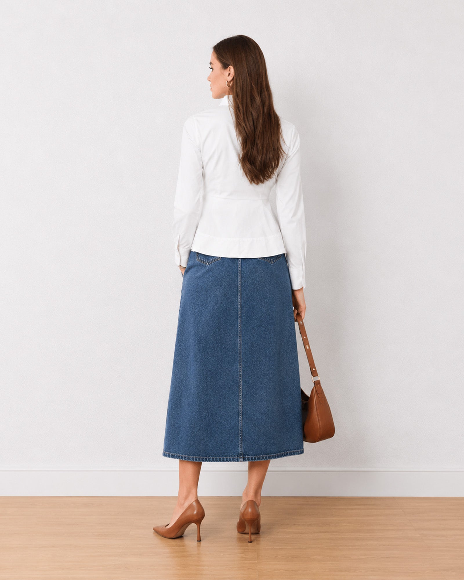 Giselle white cotton shirt, back view showing the tailored waist and peplum flare