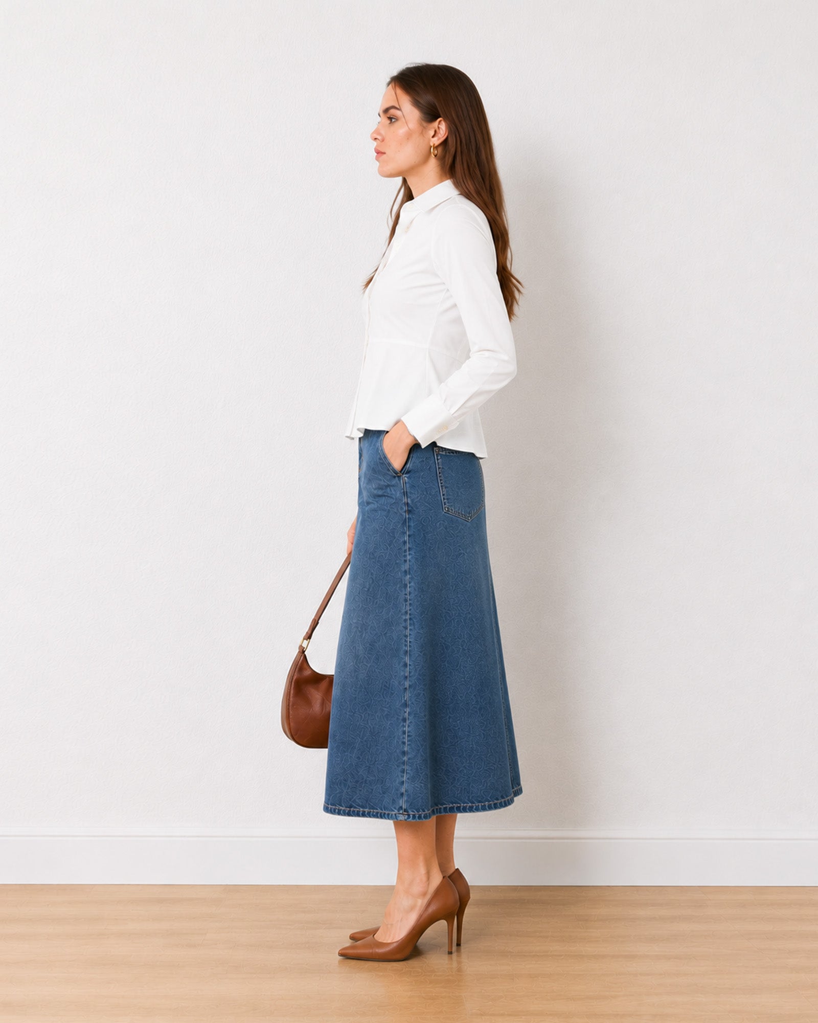 Giselle white cotton peplum shirt, side profile showing the fitted waist and flared hem