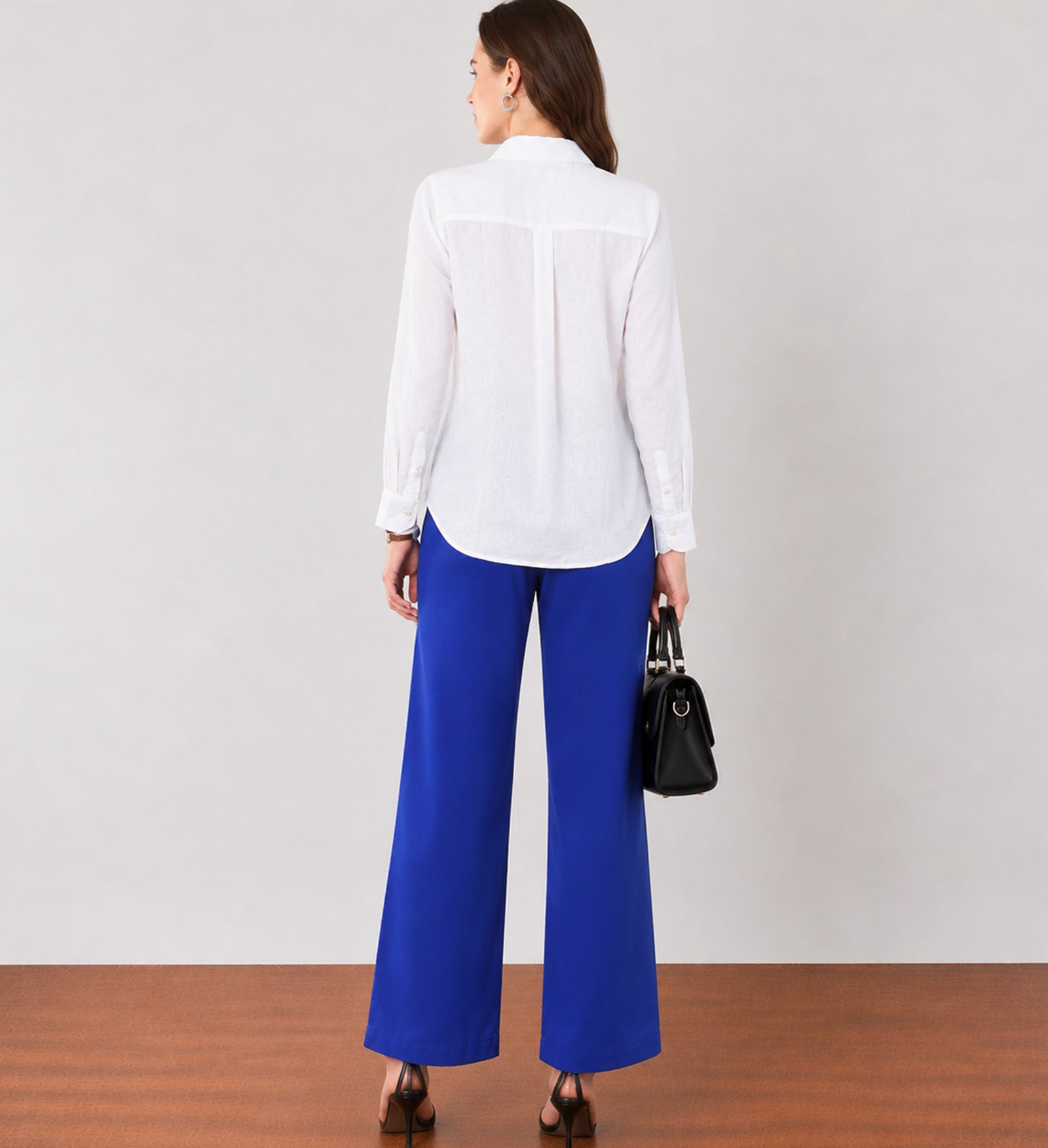 Glin royal blue mid-waisted wide leg cotton trousers, back view with a clean seat seam