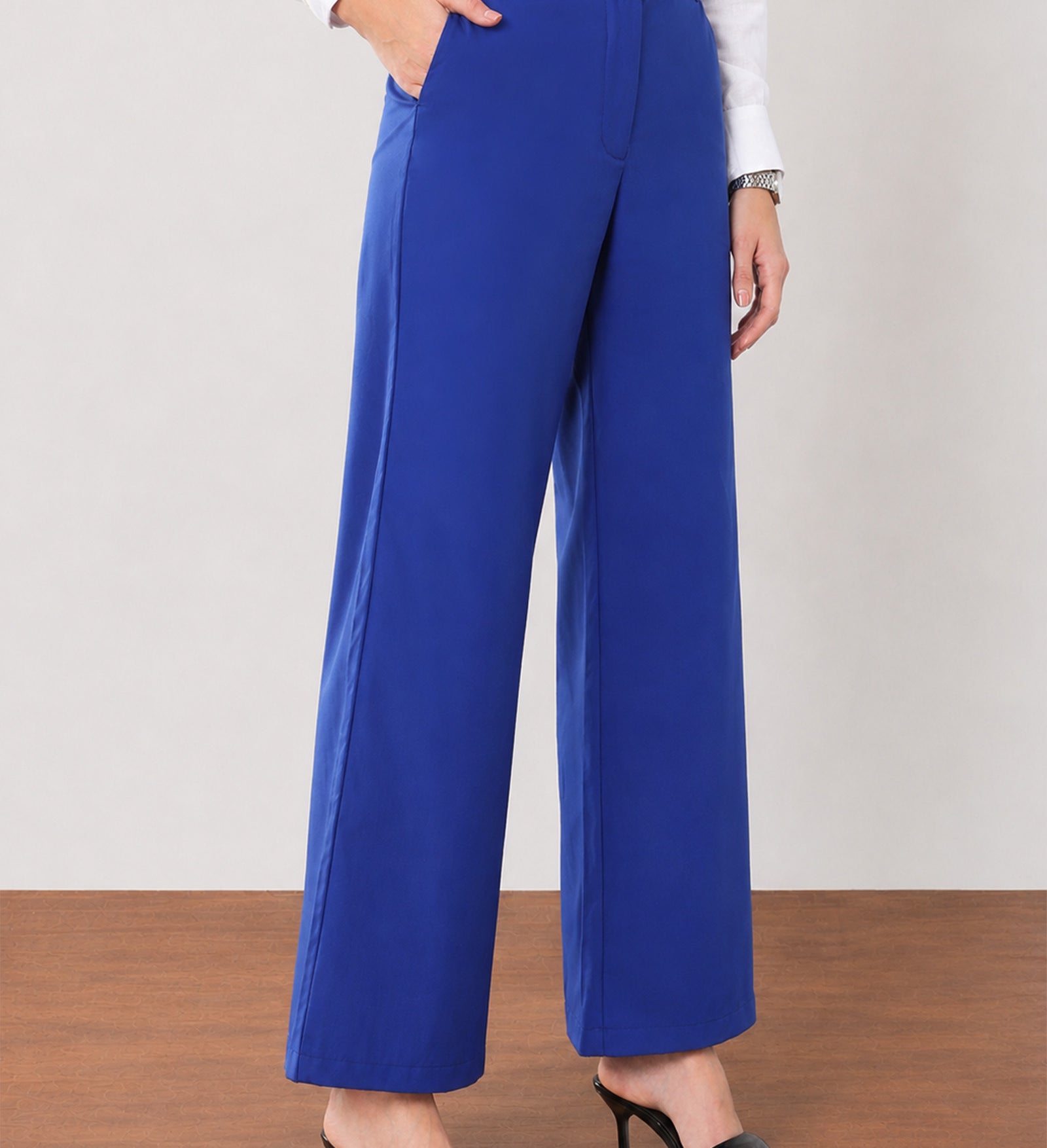 Glin royal blue cotton satin pants with deep side pockets, close-up of the voluminous wide leg drape