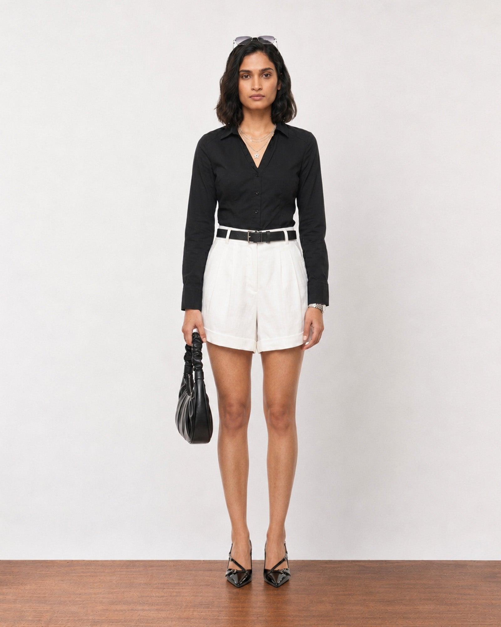 Gazillion Grace minimalist white pleated soft linen shorts for women, full-length front view