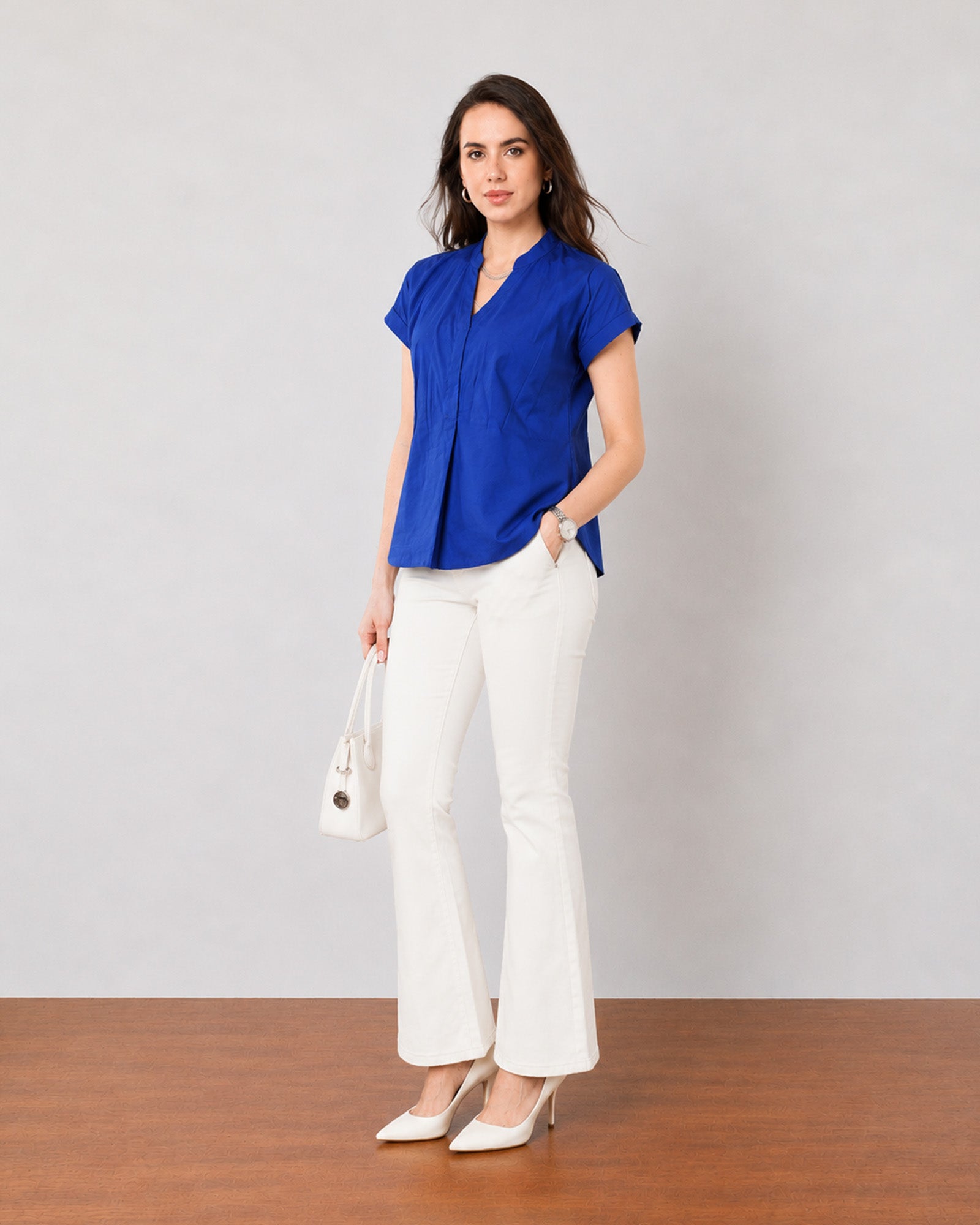 Greta royal blue cotton satin office top with a relaxed fall, angled three-quarter view